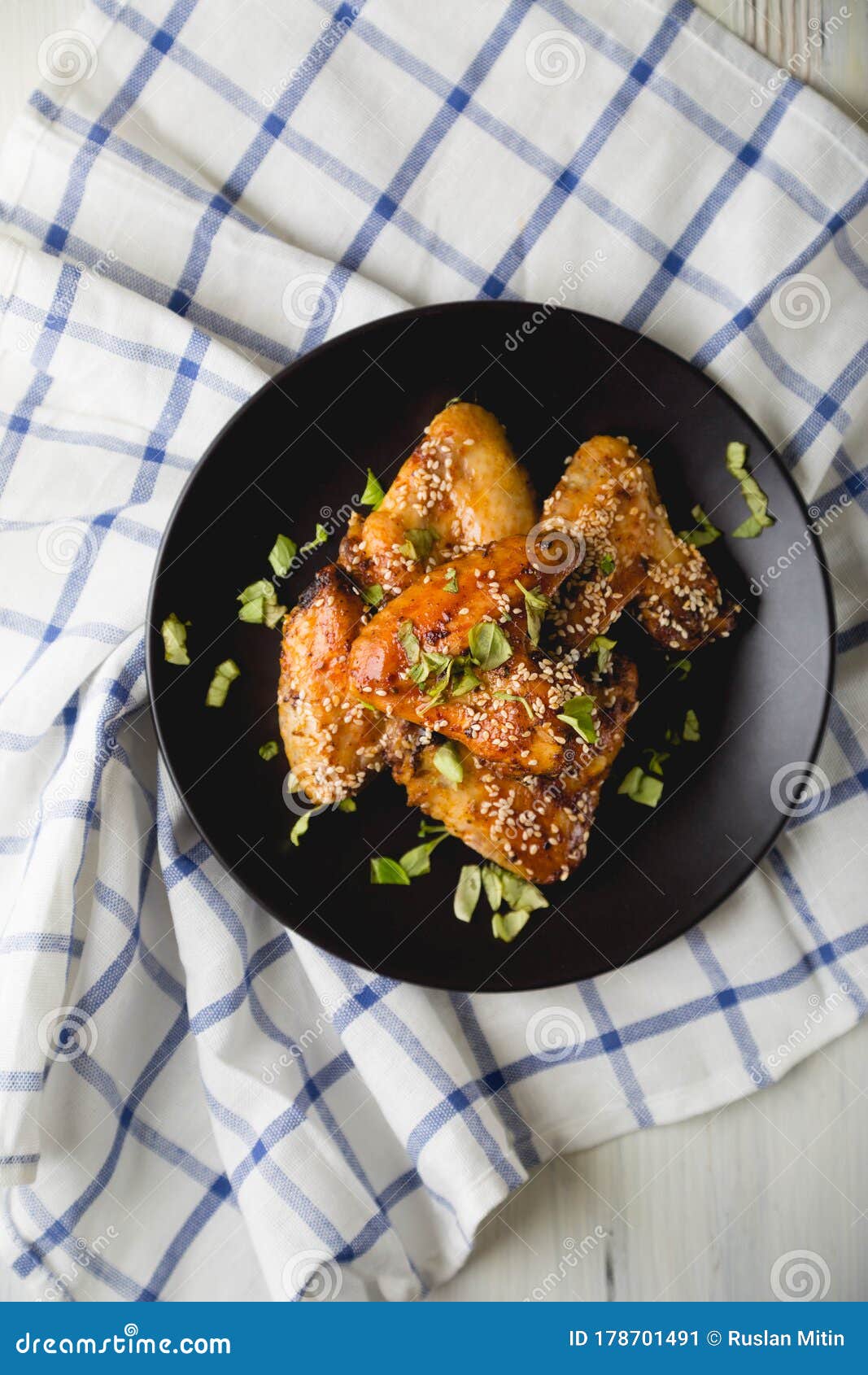 Crispy Chicken Wings with Sesame Seeds and Chopped Herbs Stock Image ...