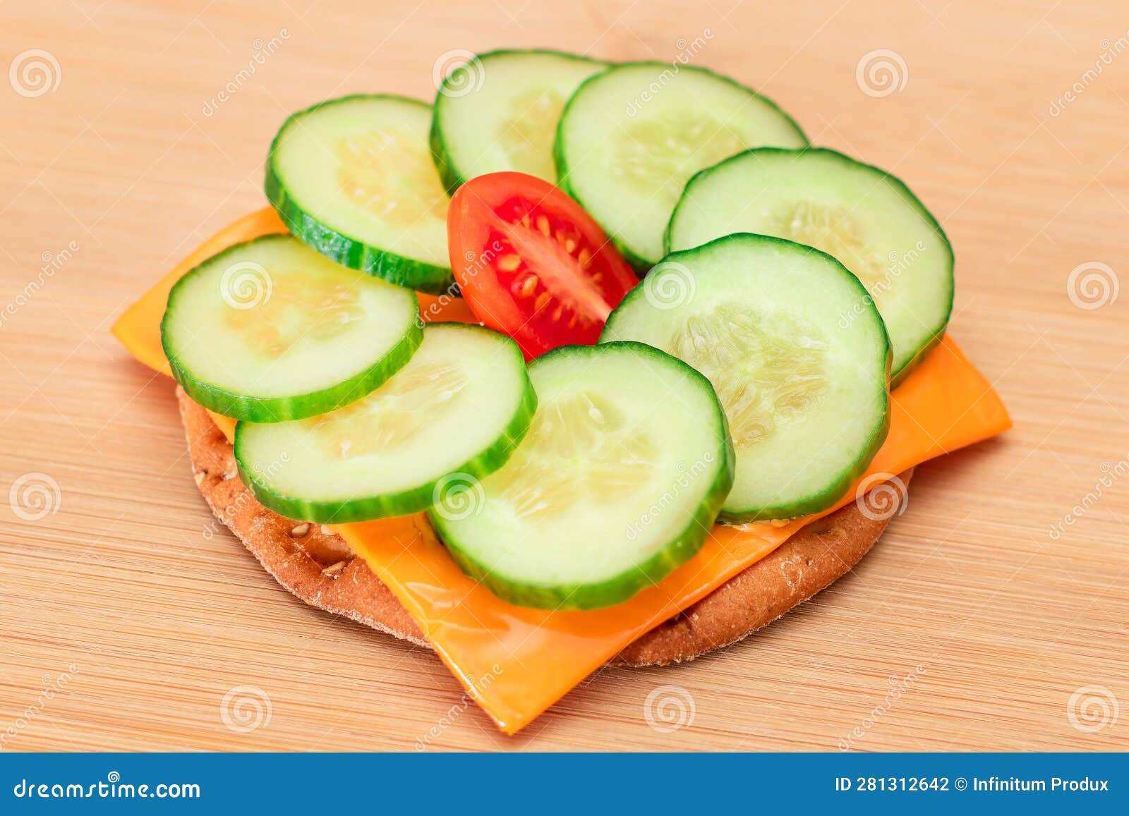 Crispy Cracker Sandwich with Fresh Cucumber, Tomato Cherry and Cheese