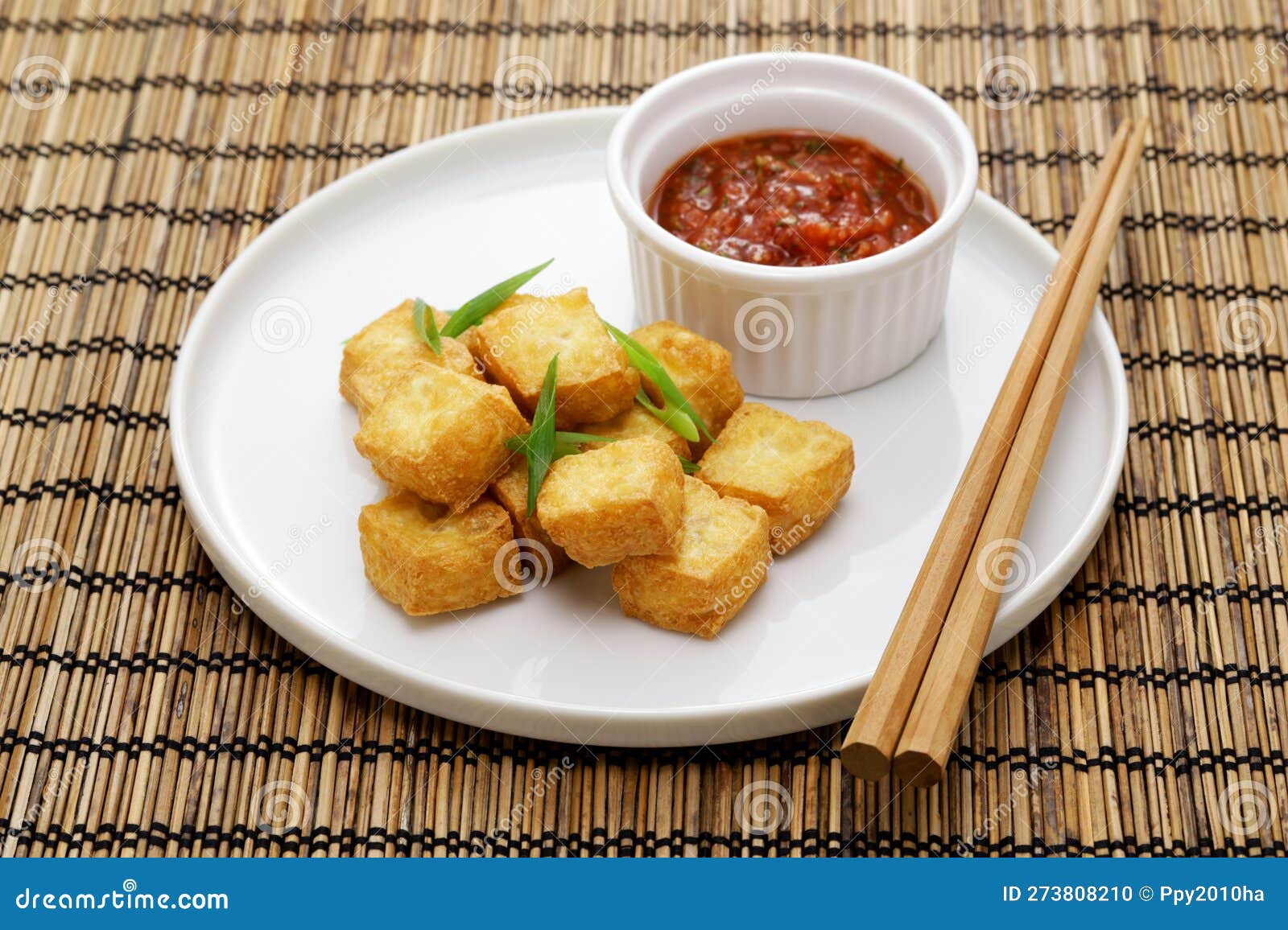 Crispy Cubed Tofu Puffs with Chili Sauce Stock Photo Image of cube, chopsticks 273808210