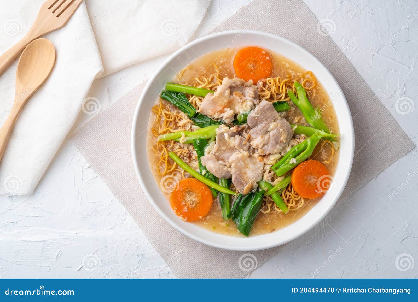 Crispy Egg Noodles with Pork in Thick Gravy Sauce.Top View Stock Photo