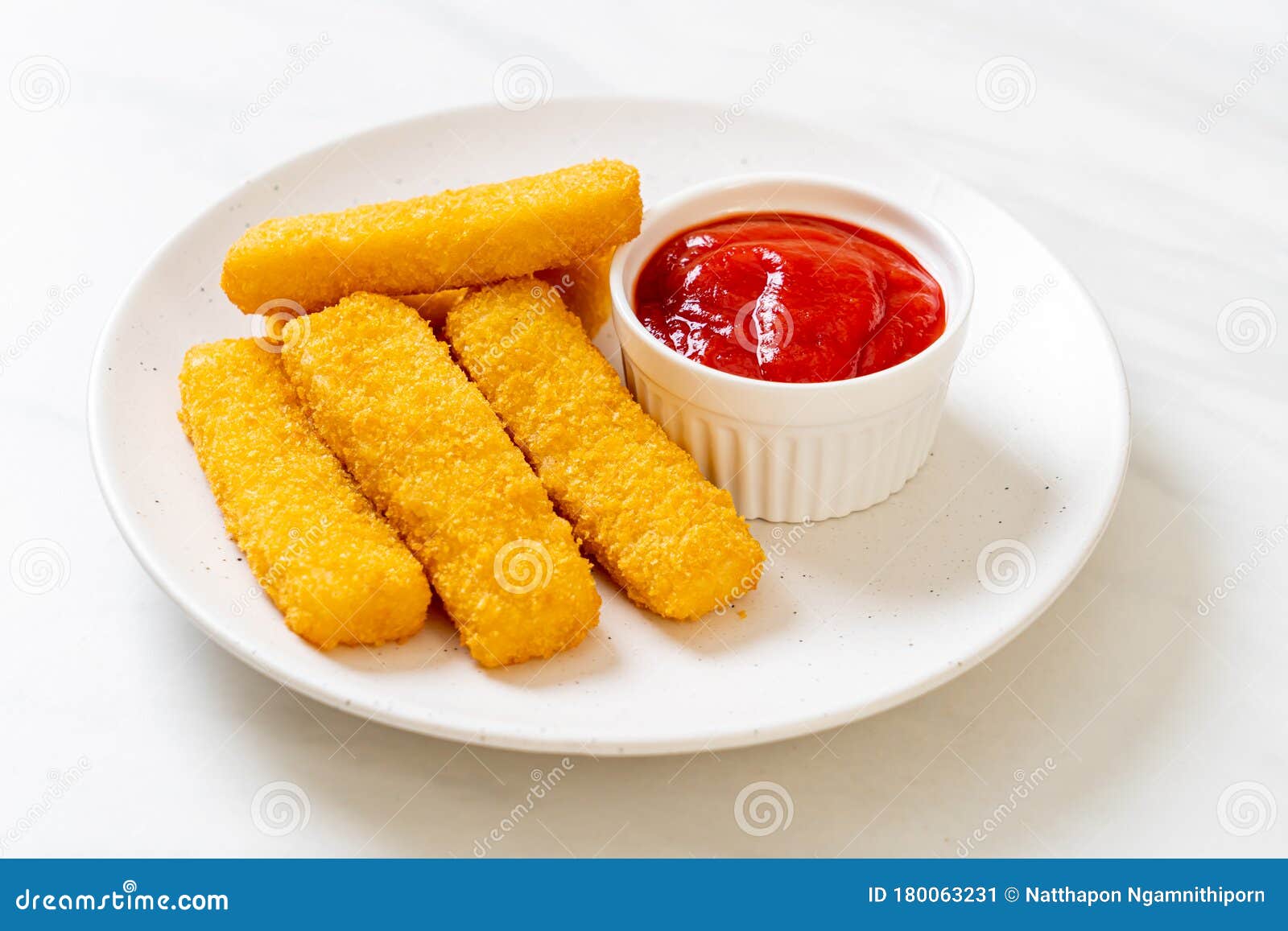 Crispy Fried Fish Fingers with Breadcrumbs Served on Plate Stock Image