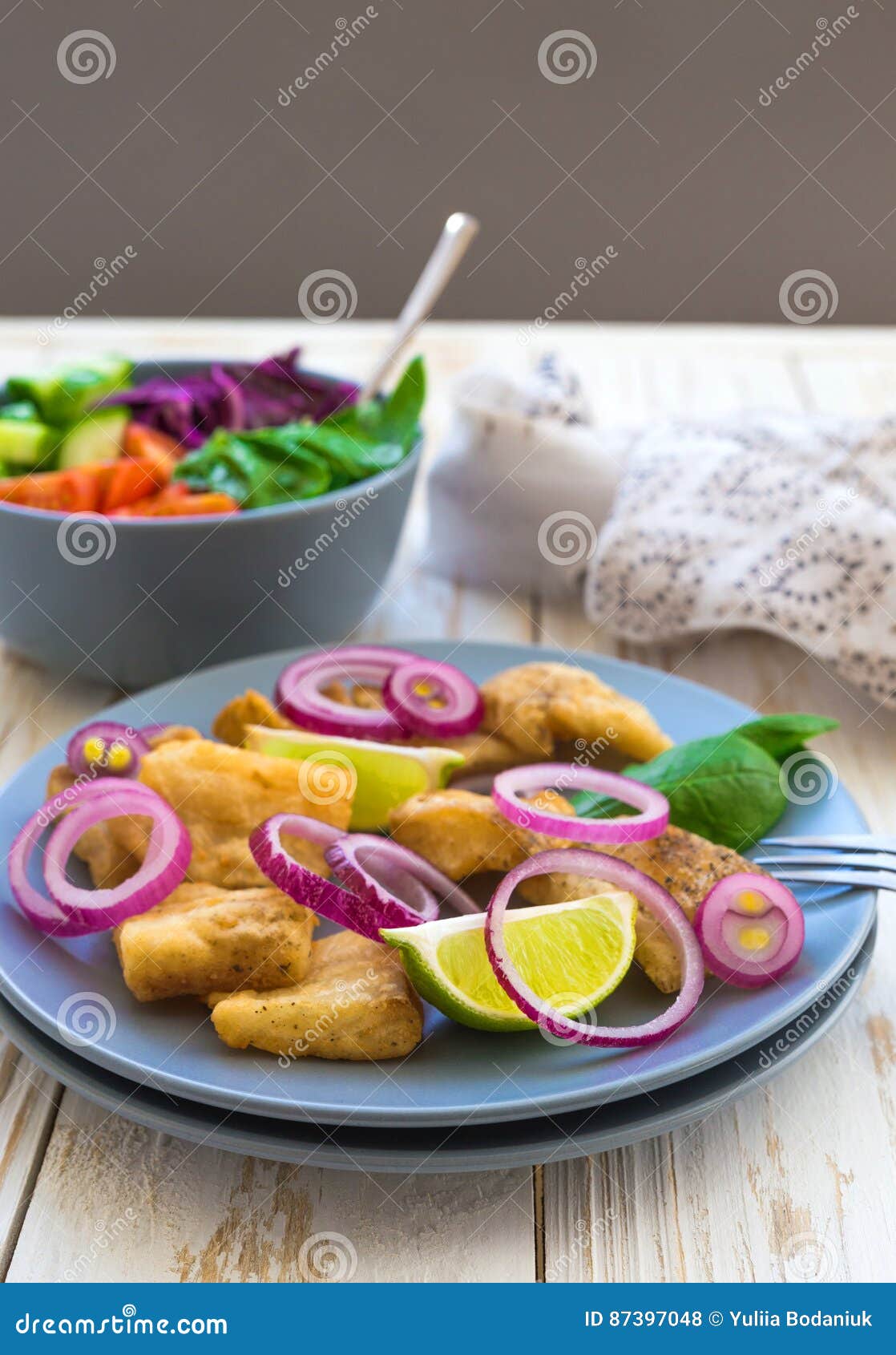 Crispy Fried Fish Tilapia and Green Vegetable Salad Stock Photo Image