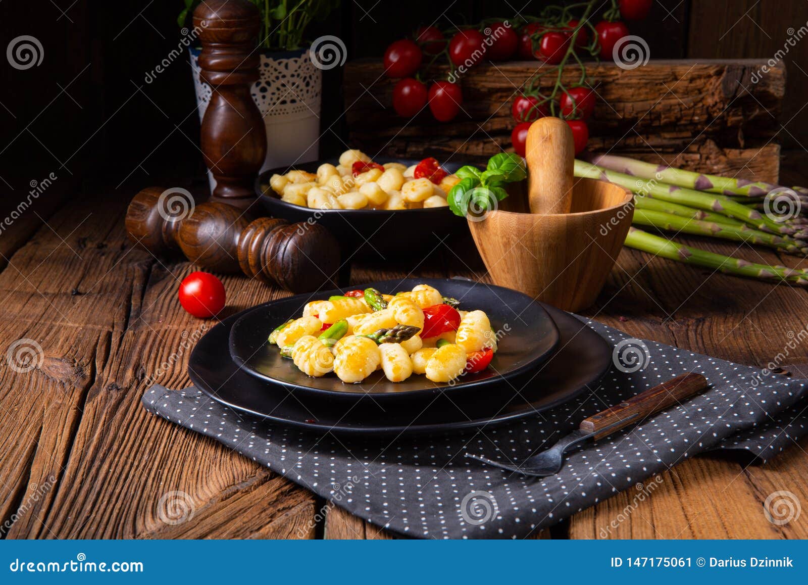 A Crispy Gnocchi with Roasted Asparagus and Tomatoes Stock Image