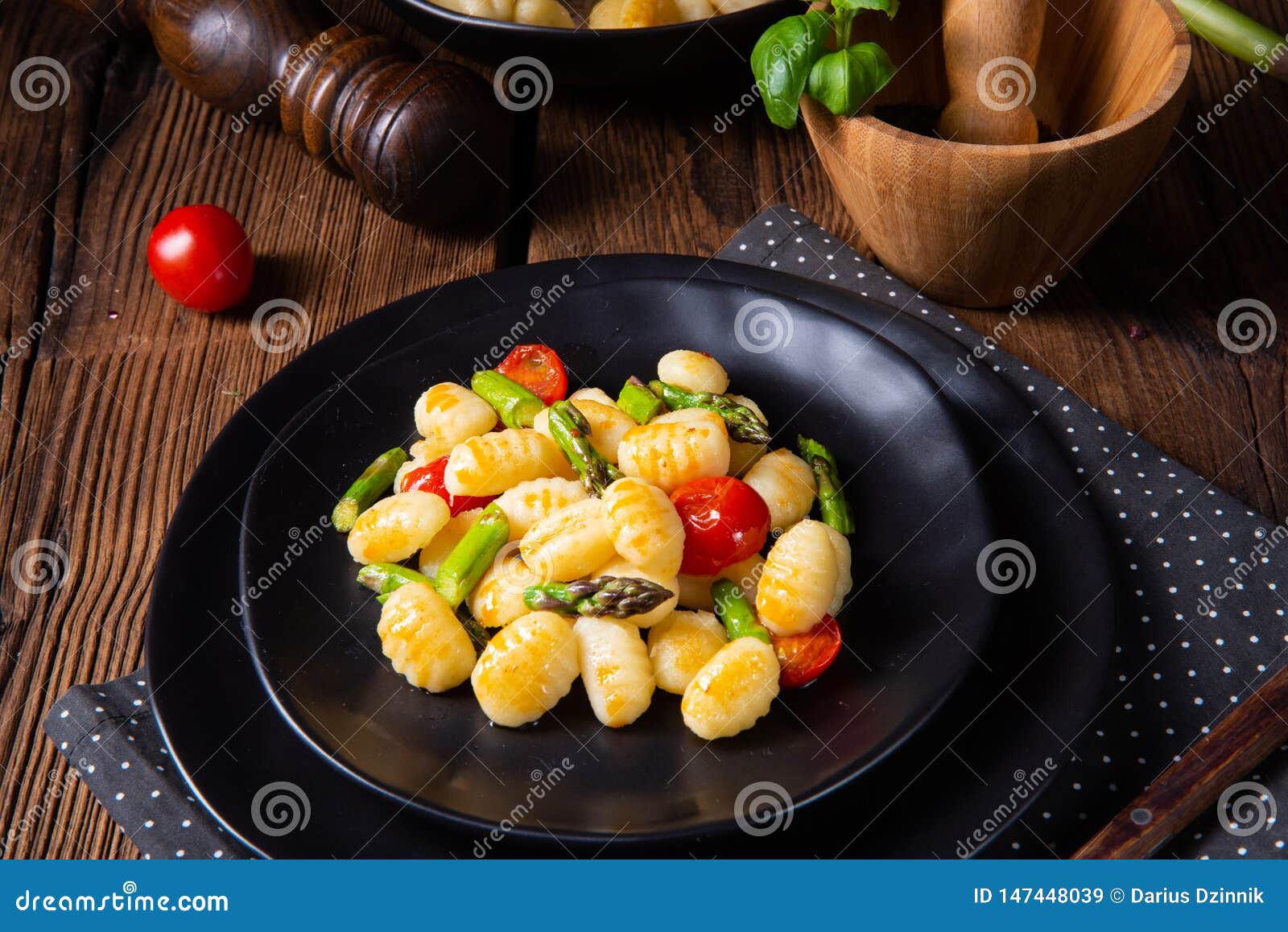 A Crispy Gnocchi with Roasted Asparagus and Tomatoes Stock Image