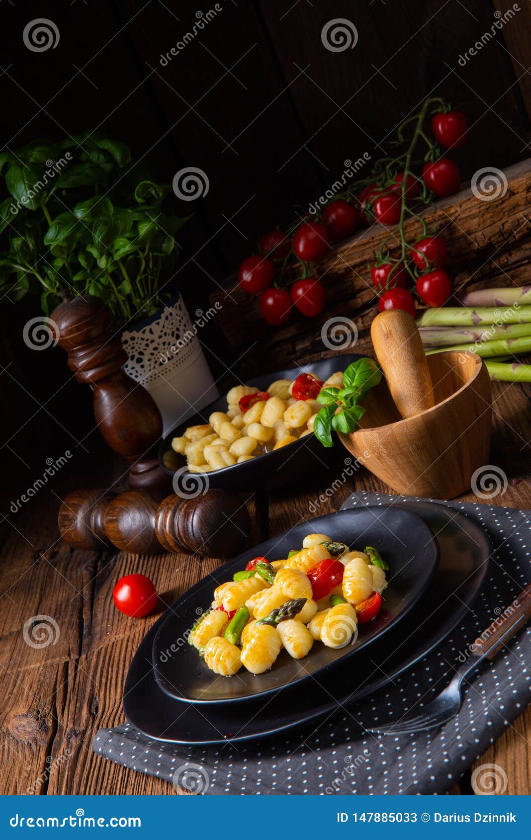 A Crispy Gnocchi with Roasted Asparagus and Tomatoes Stock Image