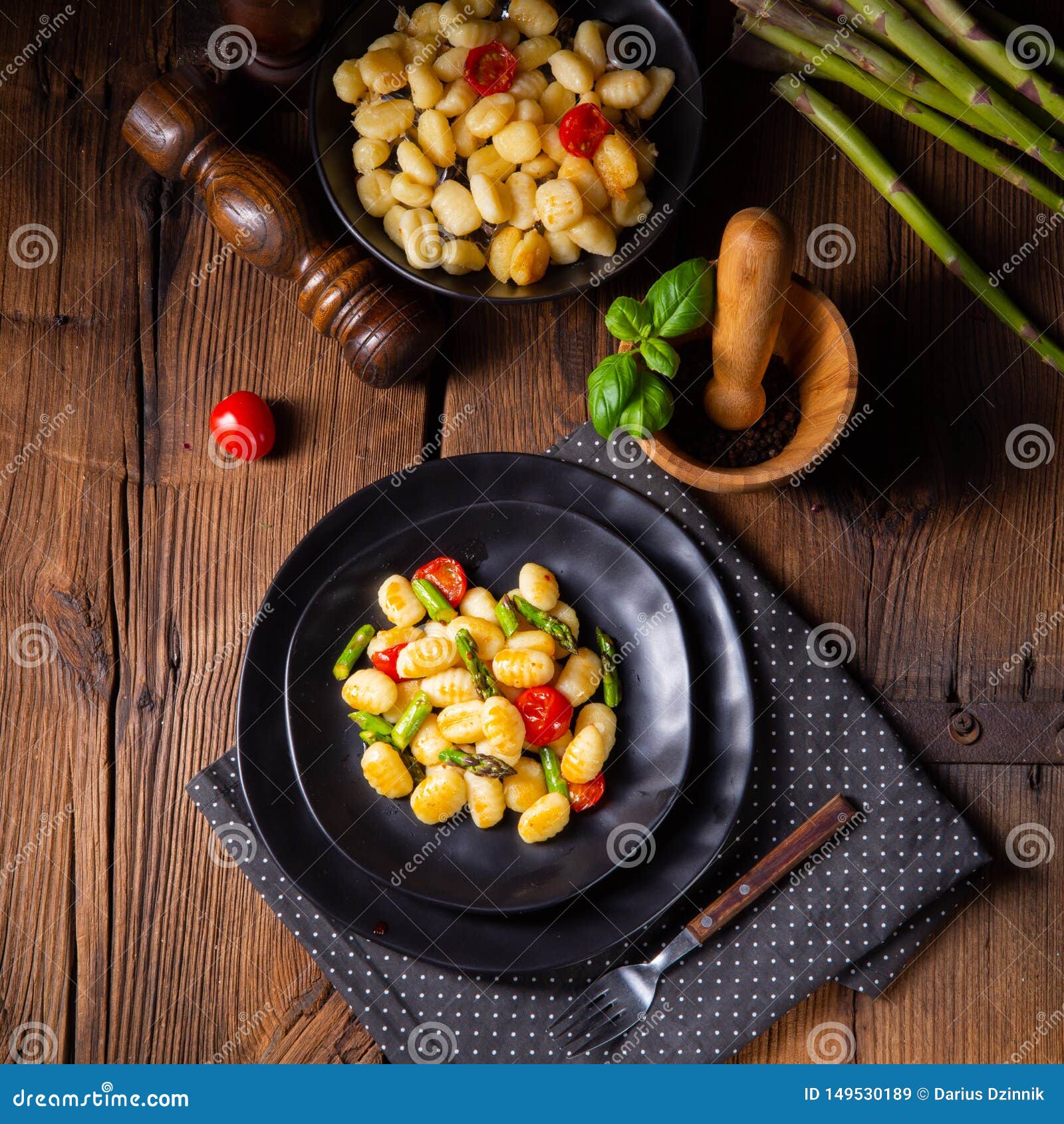 A Crispy Gnocchi with Roasted Asparagus and Tomatoes Stock Image
