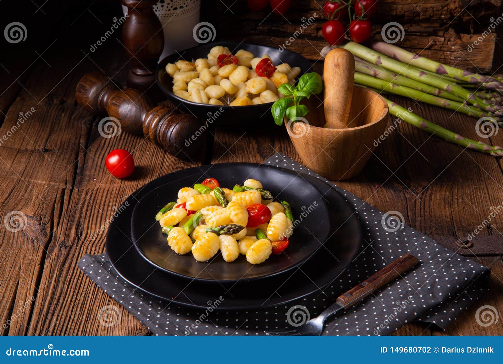 Crispy Gnocchi with Roasted Asparagus and Tomatoes Stock Photo Image