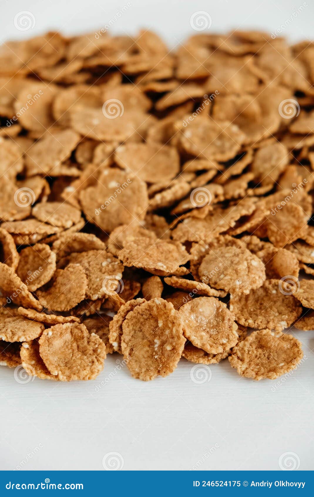 Crispy Healthy Dry Cereal Flakes on White Background Stock Image