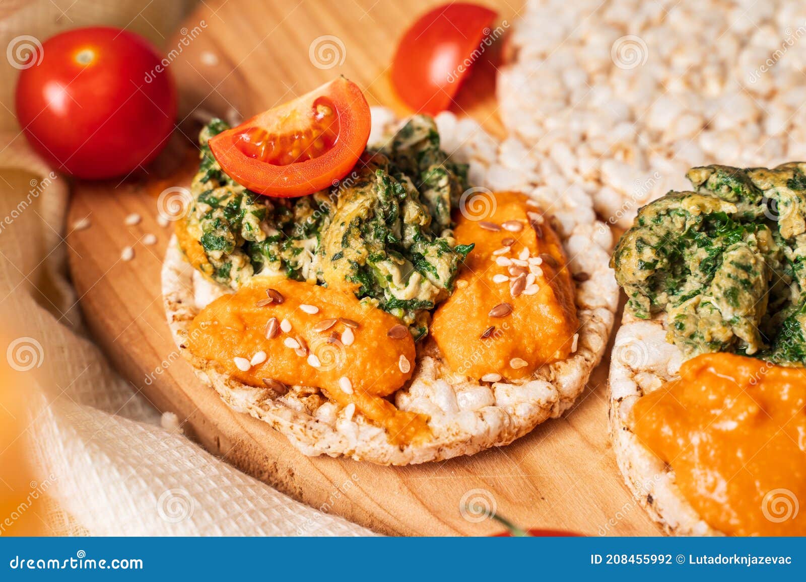 Crispy Puffed Rice Cakes on Table with Hummus Spread Spinach with Eggs