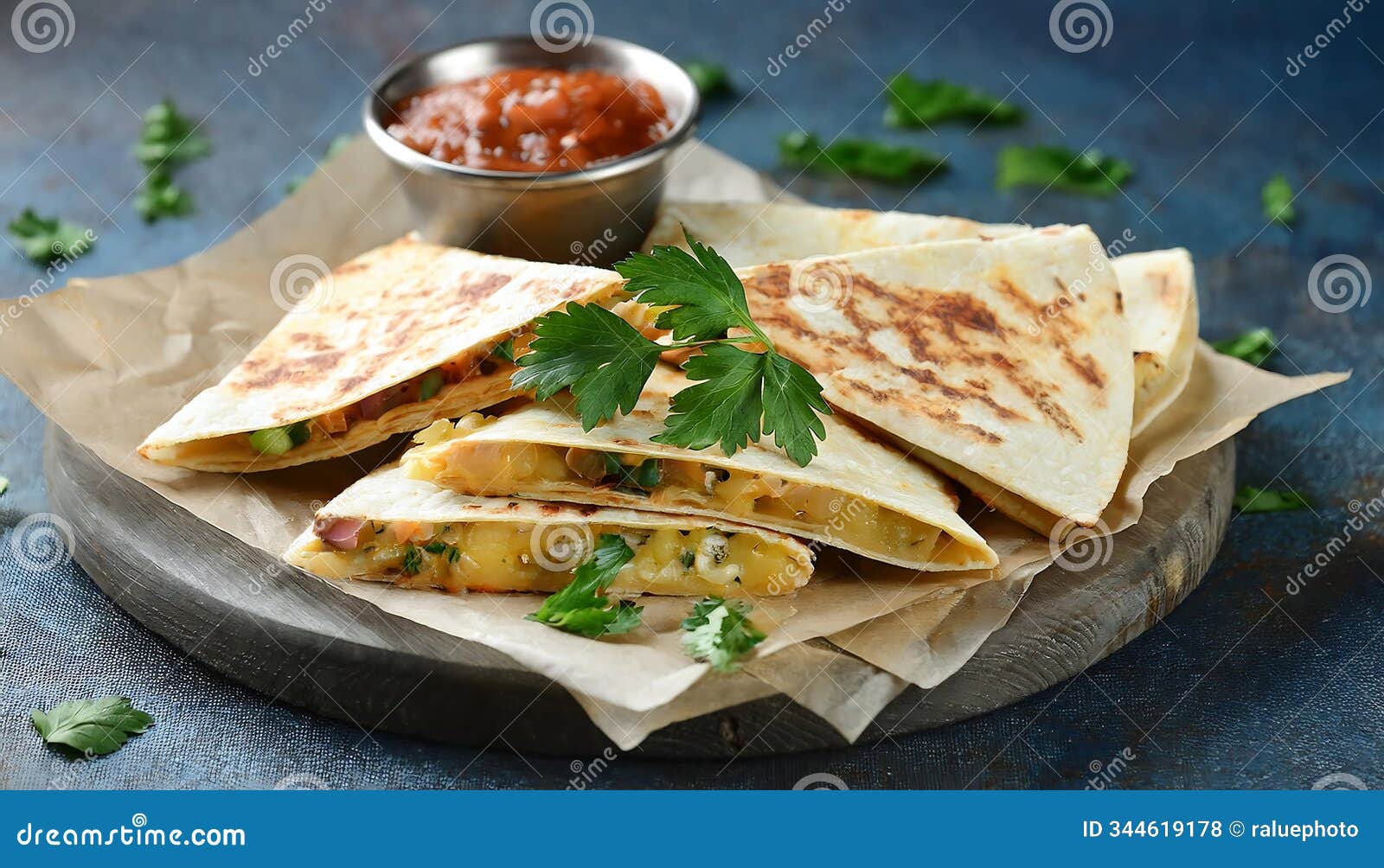 crispy quesadillas, folded and filled, are served on parchment paper with a small bowl of salsa and garnished with cilantro