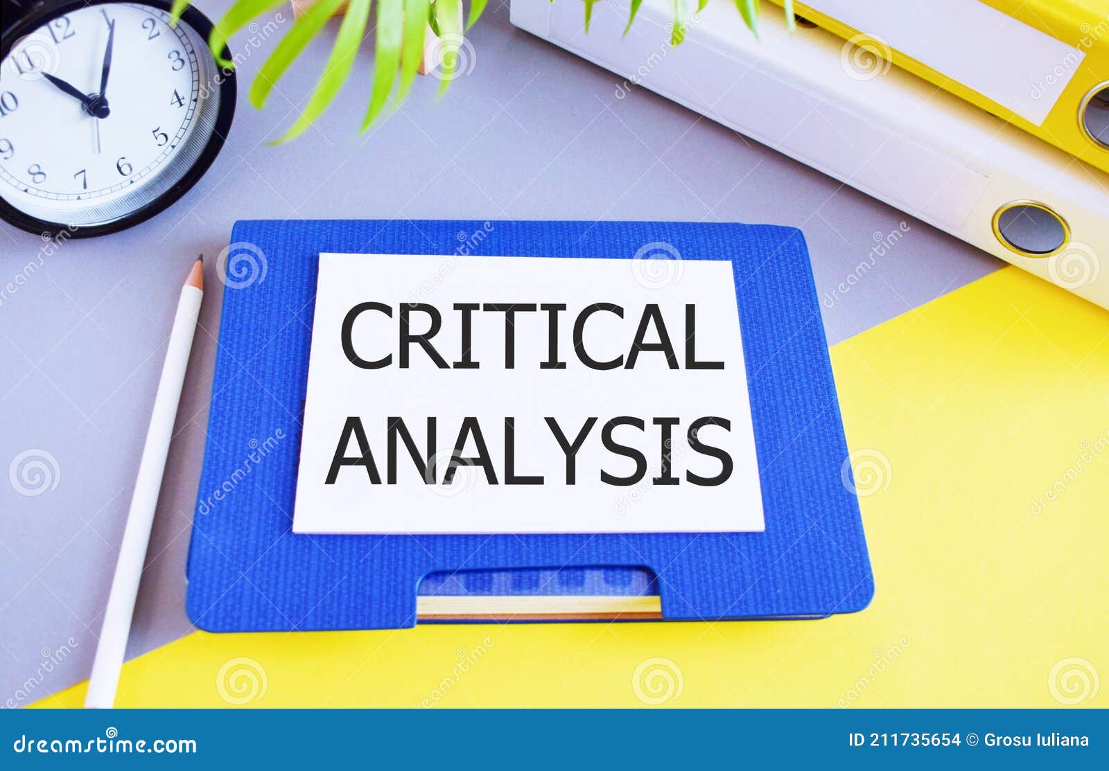 Critical Analysis Text Written on White Paper Above Notebook. Concept
