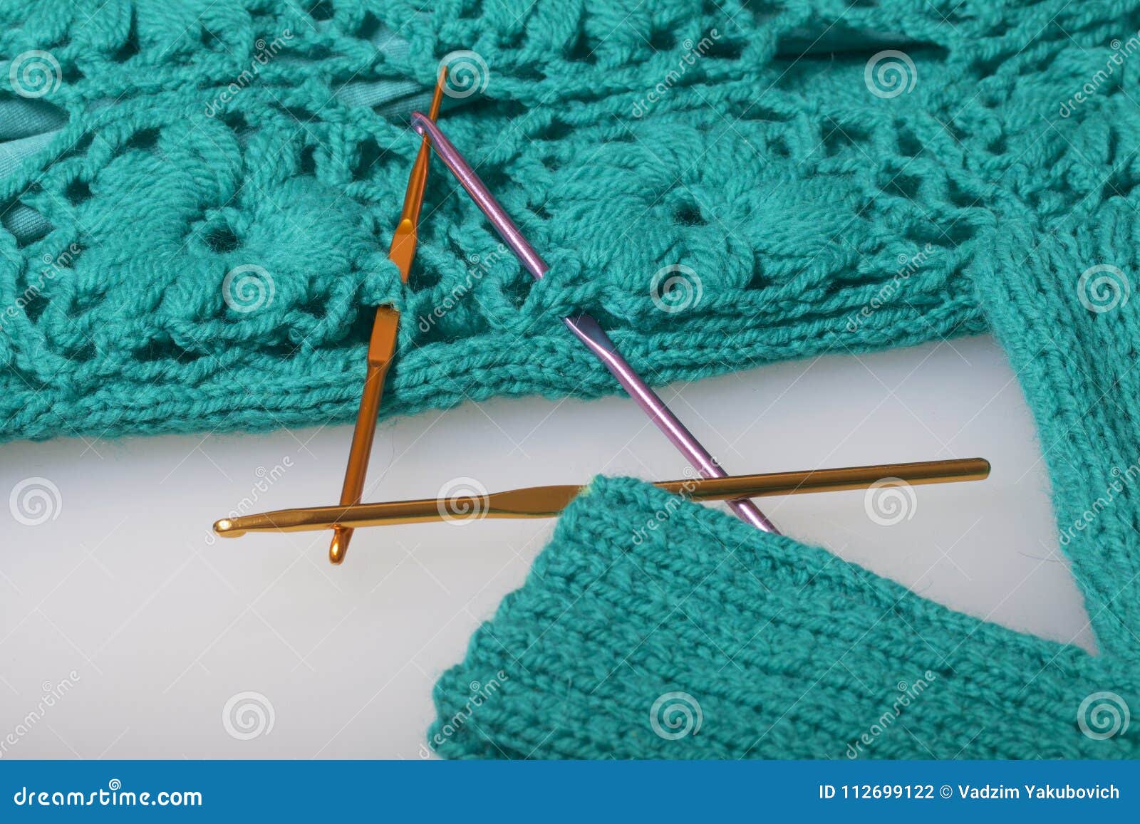 Crochet Hooks are Stuck in the Finished Knitted Product. Stock Photo