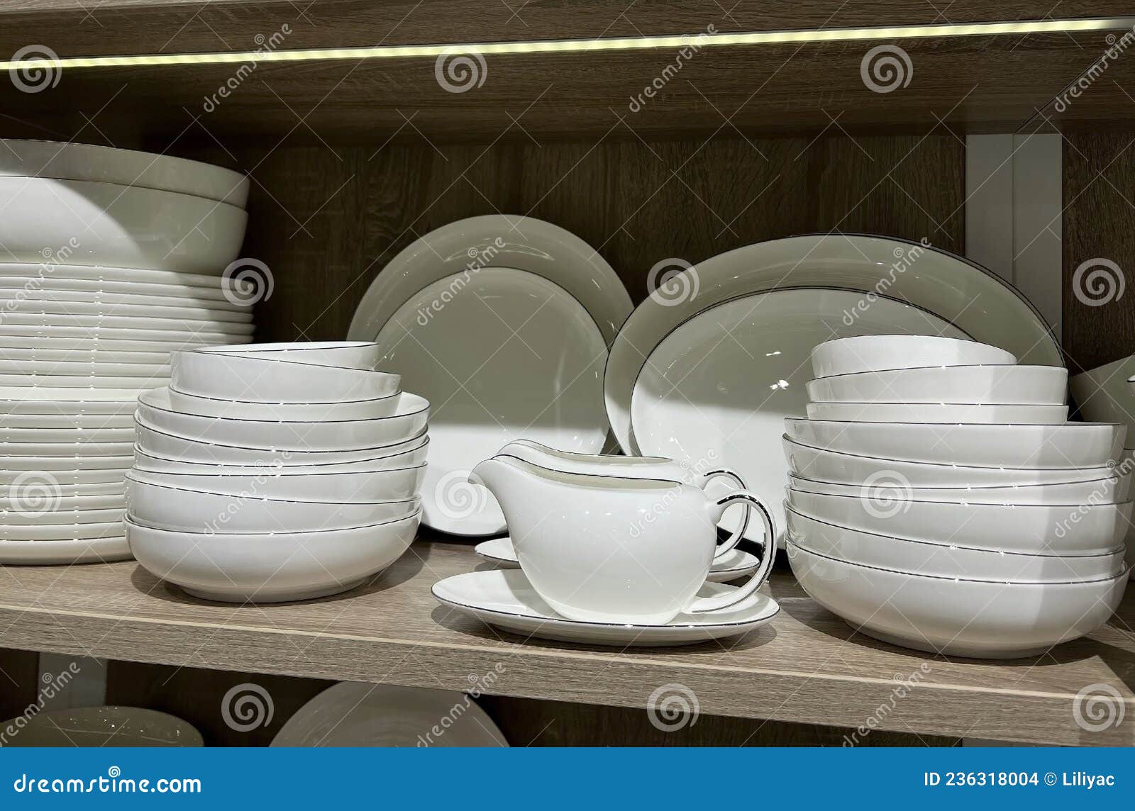 Crockery Plates on the Shelf. Cutlery for the Kitchen or Restaurant