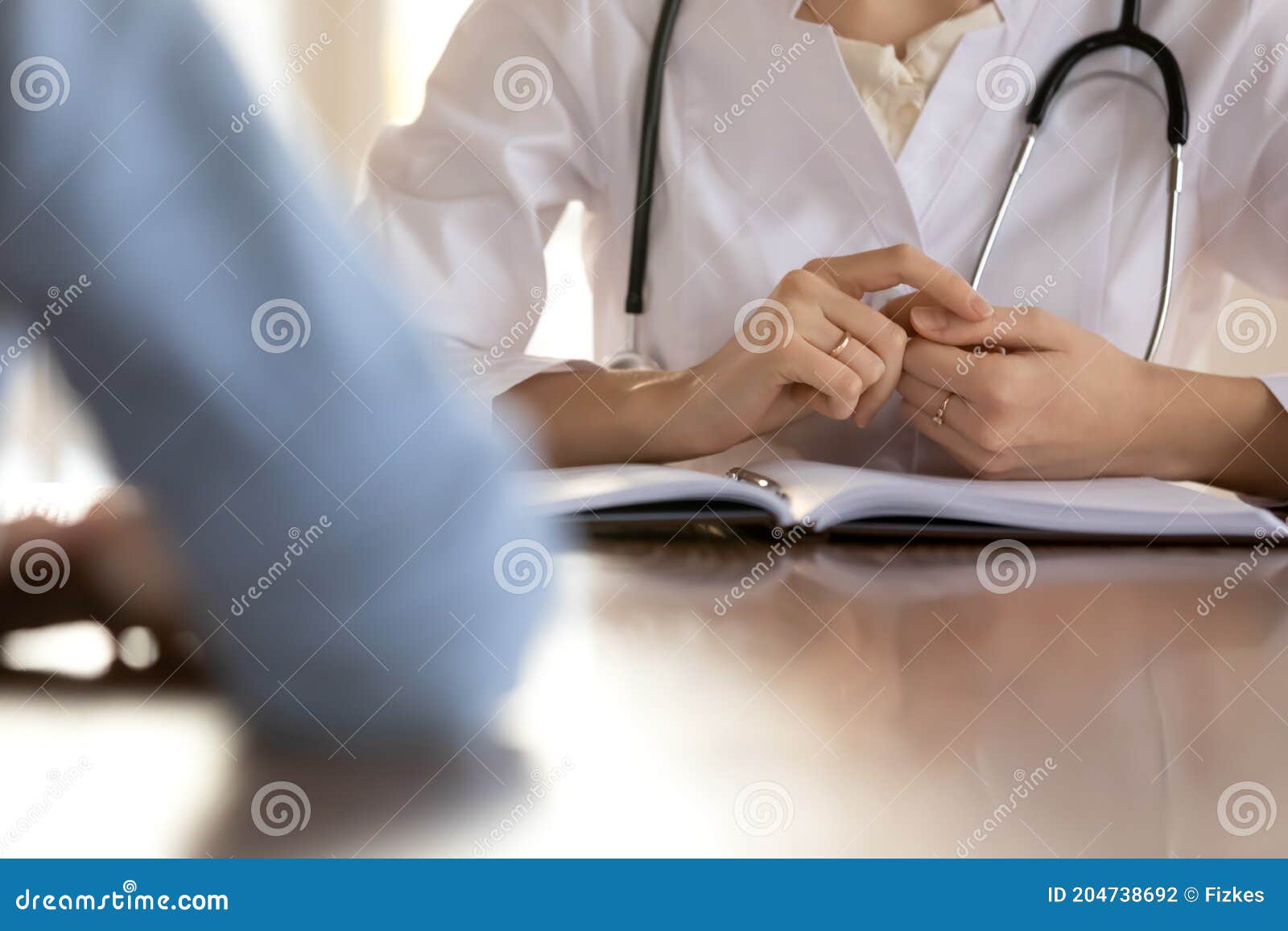 close up of female doctor have consultation with patient