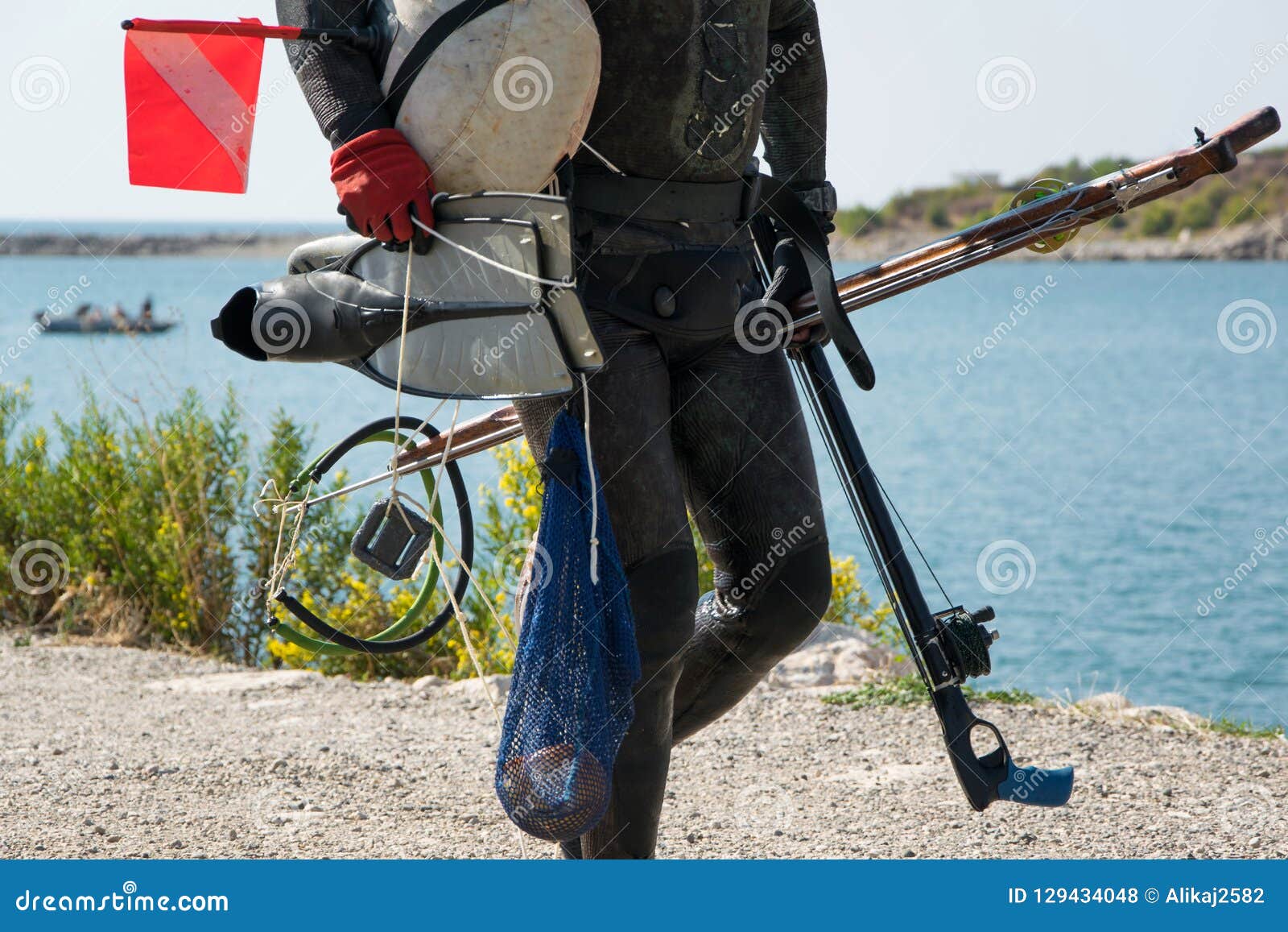 Crop View of Scuba Diver Adult Man on a Seashore with Spearfishing