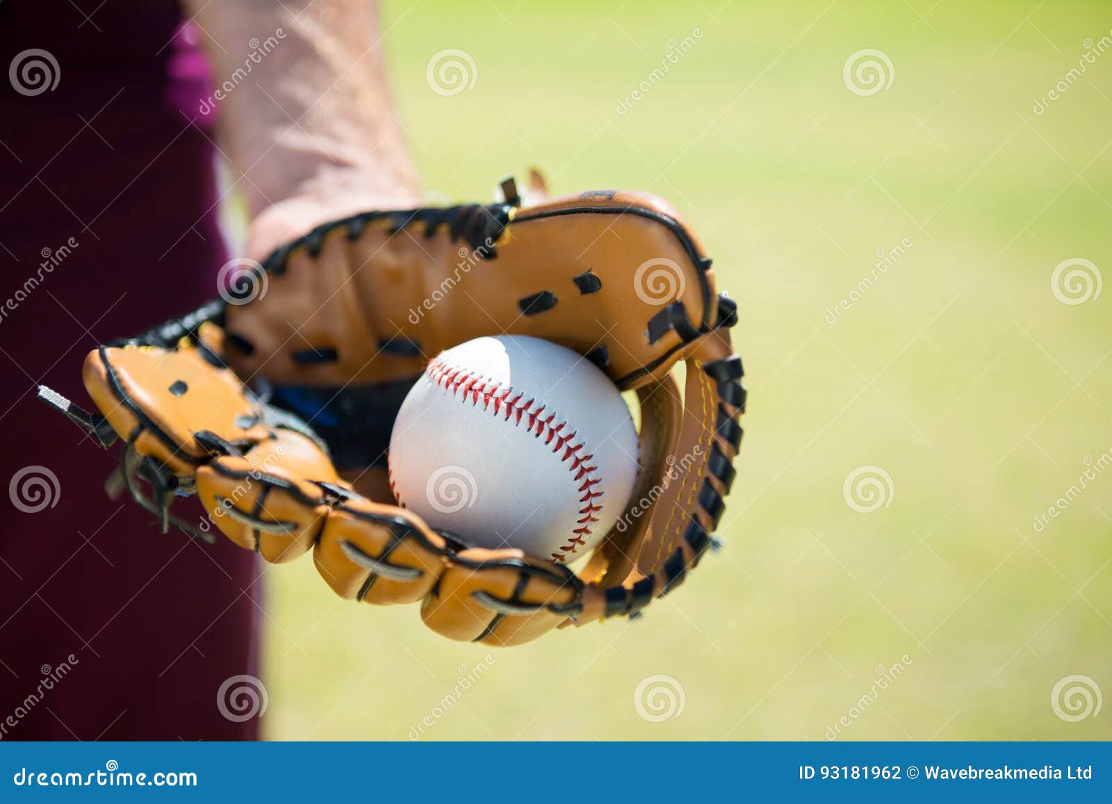 Cropped Image of Baseball Pitcher Holding Ball on Glove Stock Photo