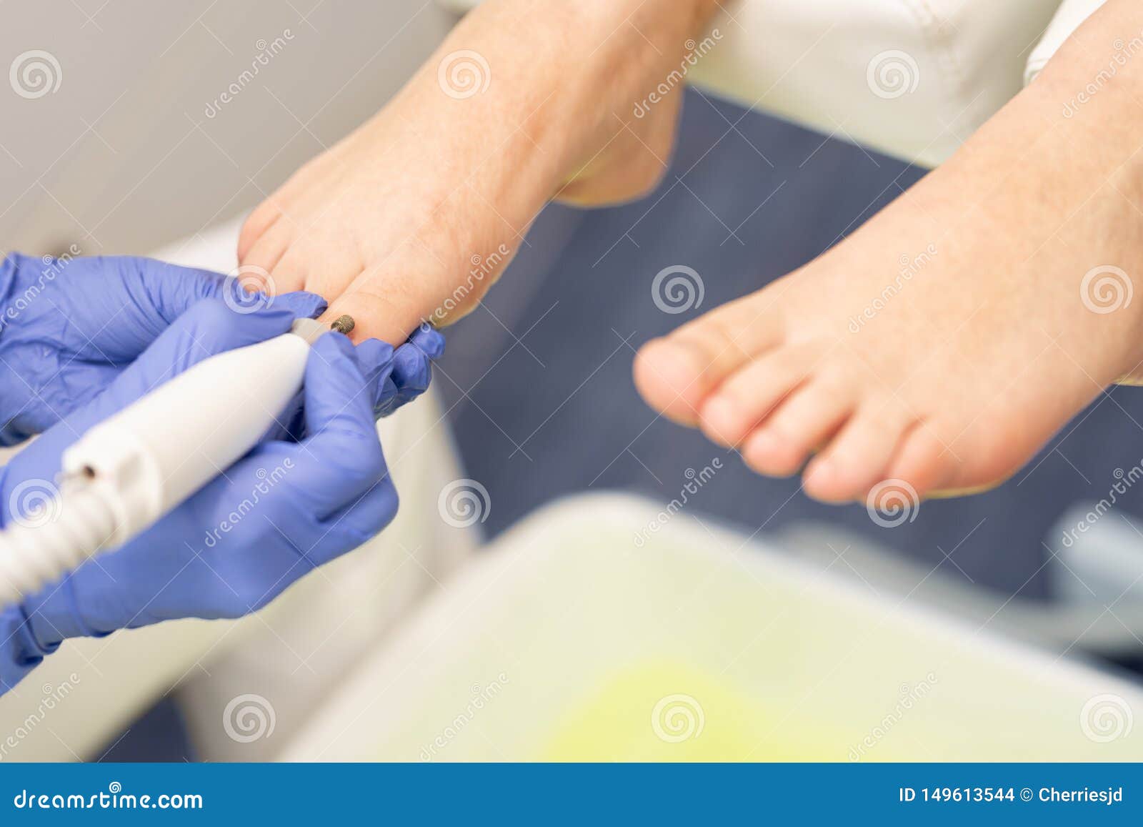 cropped image of chiropodist with patient in clinic