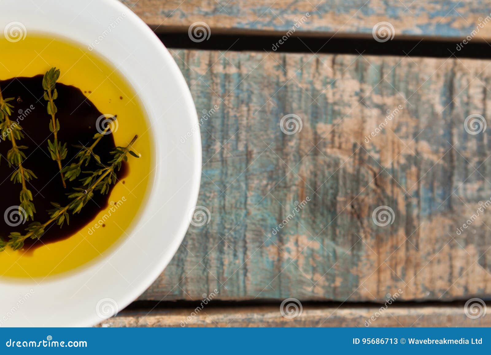 Cropped Image of Herbs in Olive Oil Stock Image Image of table