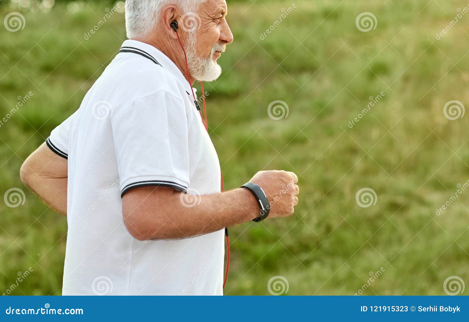 cropped photo of old man listening to music while running .