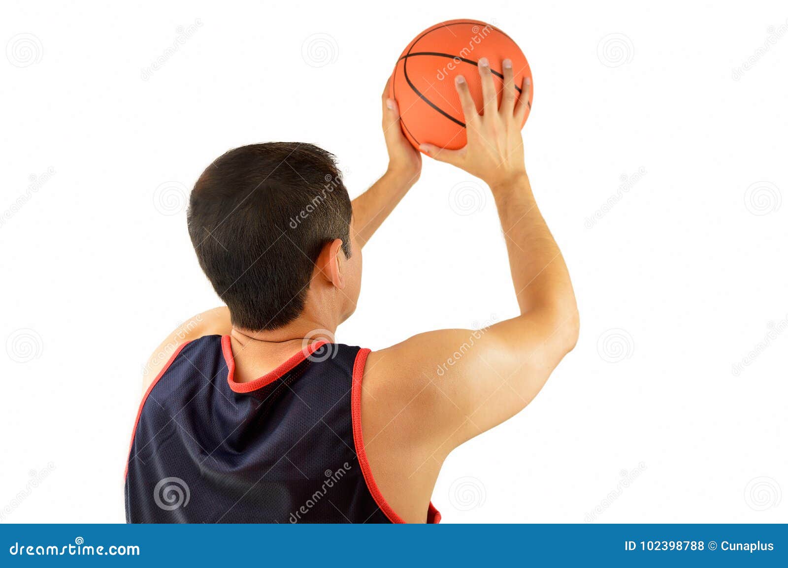 Basketball player posing with ball Stock Photo - Alamy