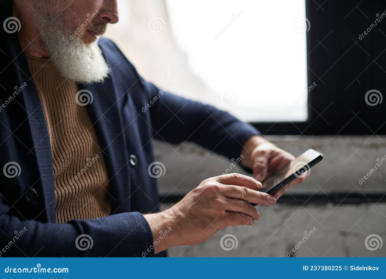 Cropped Shot of Bearded Middle Aged Man in Business Casual Wear Using His  Smartphone while Sitting by a Window in Modern Stock Image - Image of  indoors, businessman: 237380225