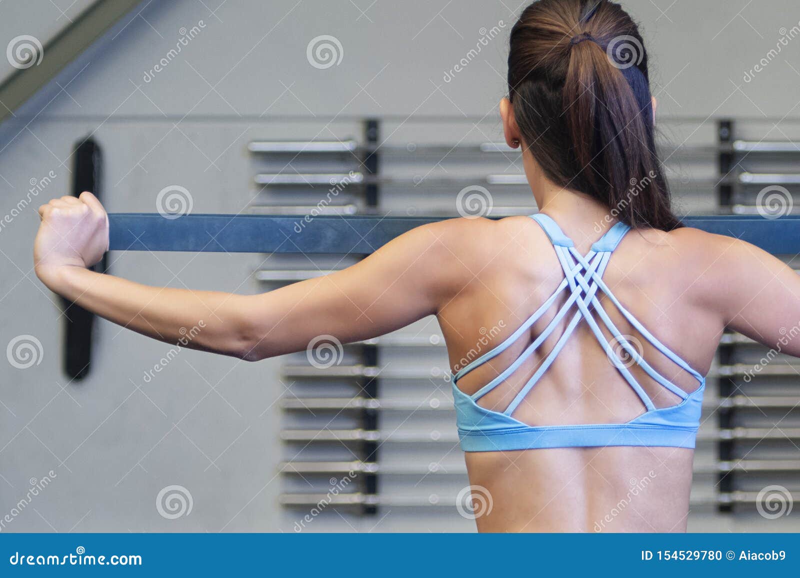 Young Caucasian Woman Using a Resistance Rubber Band To Tone Her Back Stock  Photo - Image of energy, endurance: 154529780