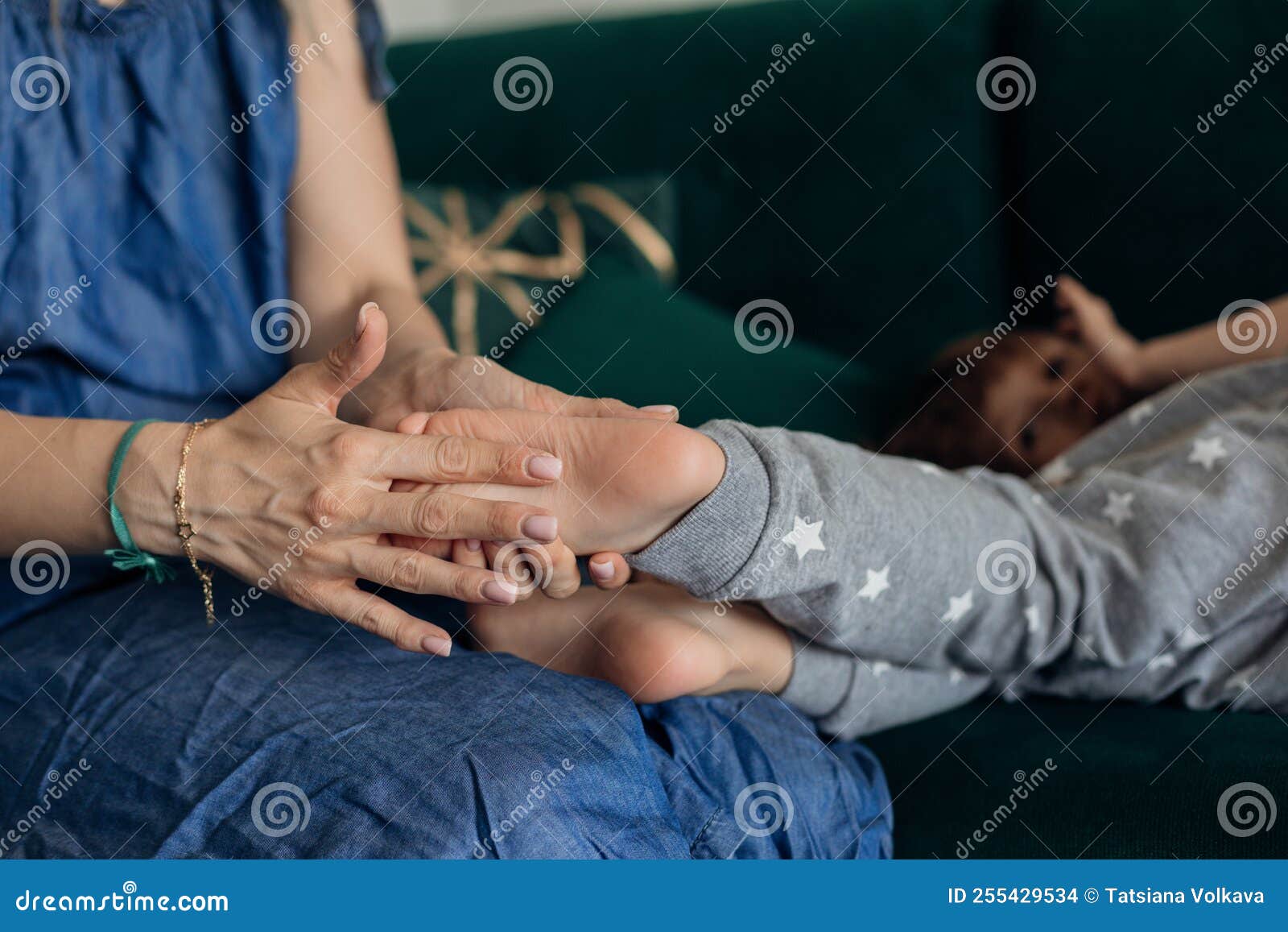 Cropped Tender, Gentle Woman Hands Hold Little Boy Son Bare Feet with