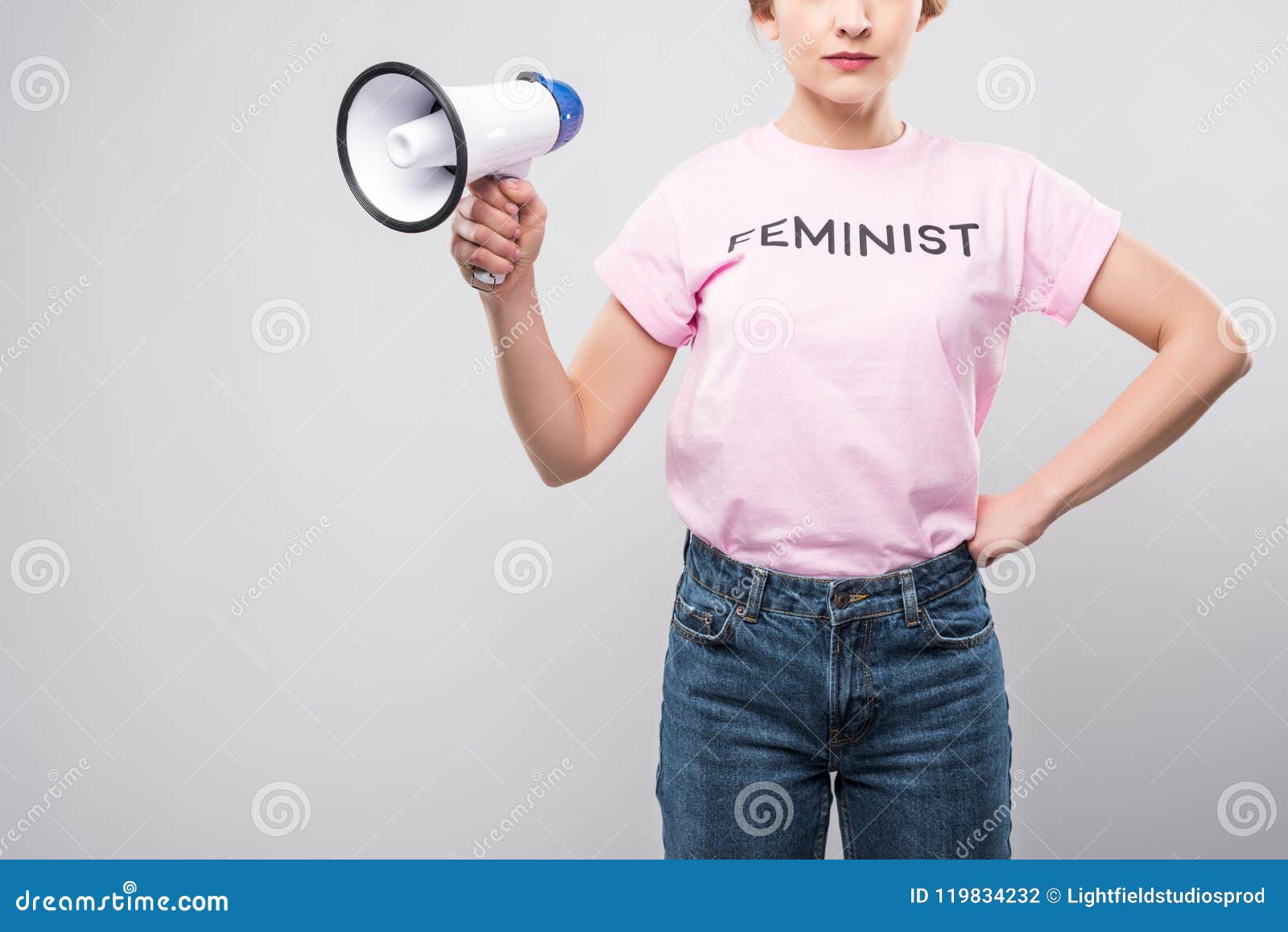 cropped view of woman in pink feminist t-shirt holding megaphone,