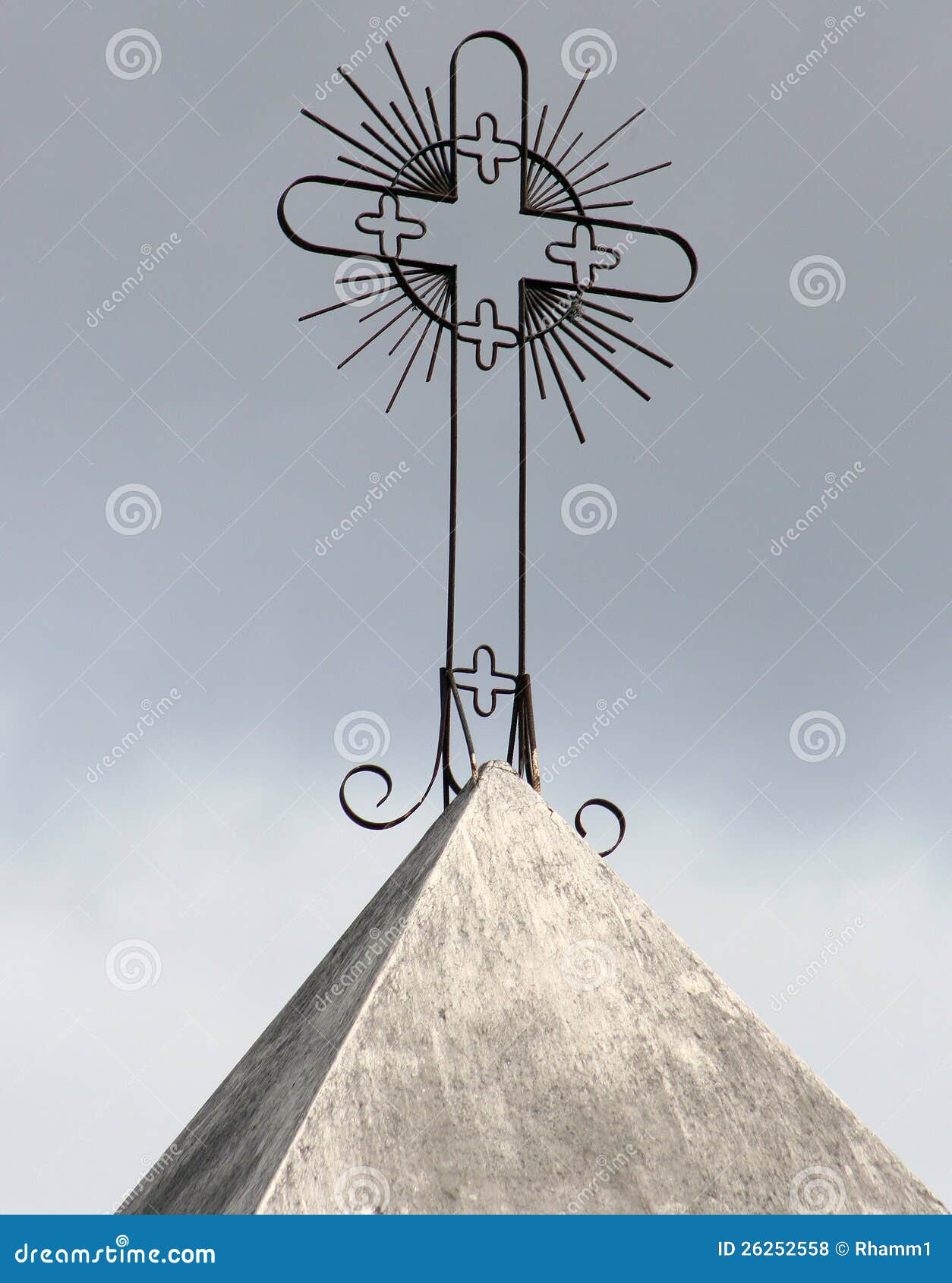 Cross on a Catholic Church. An ornate steel cross on the steeple of a Catholic Church in Cotacachi, Ecuador