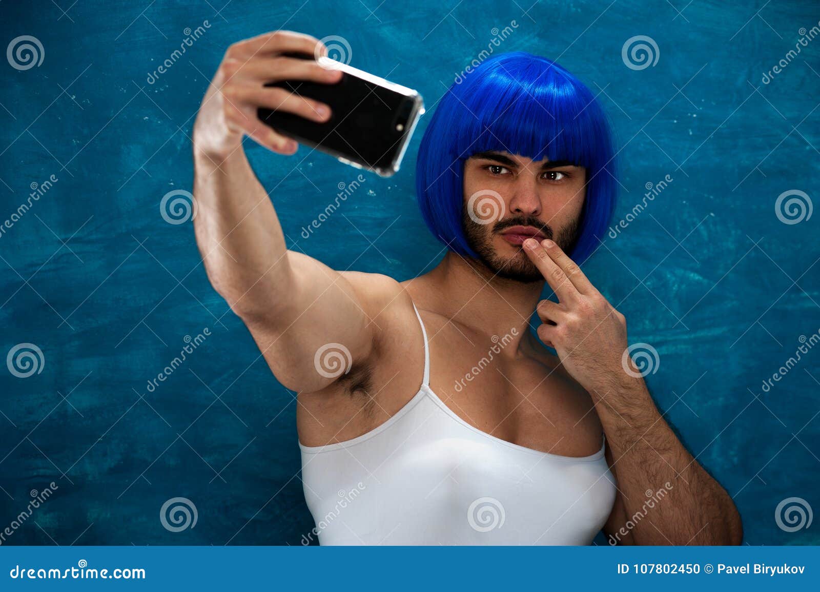 Cross Dressing Person In Blue Wig With Smartphone Stock Photo