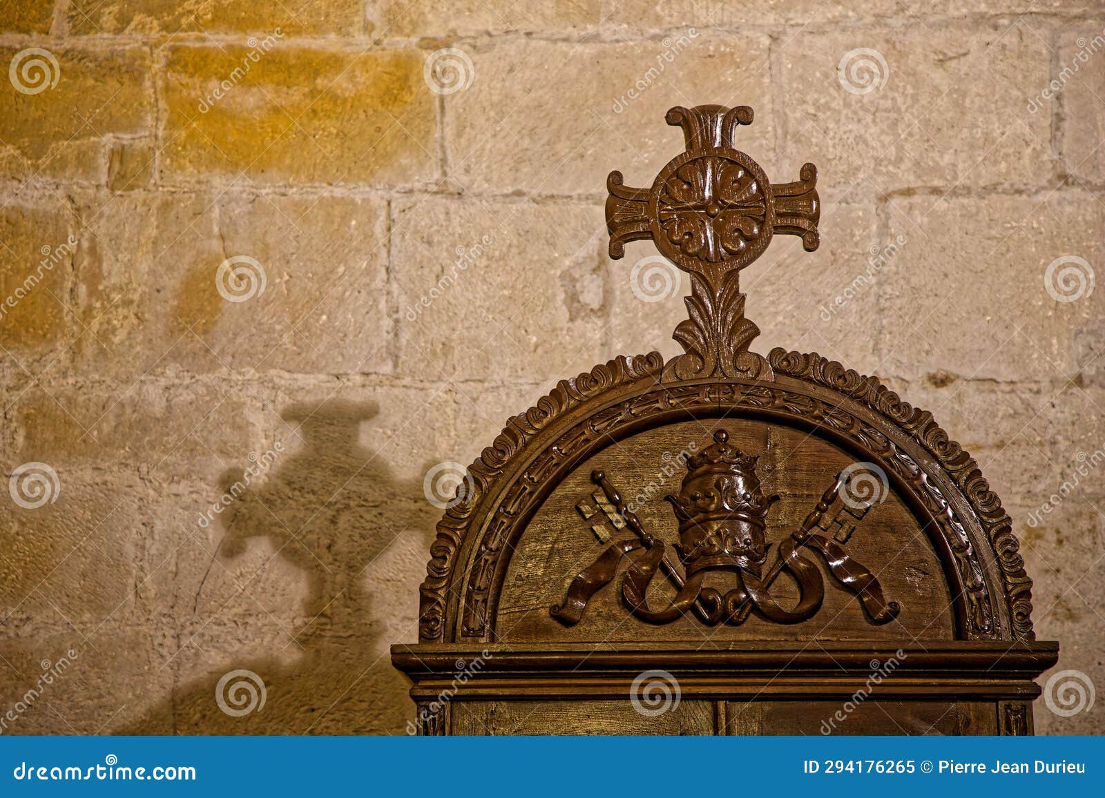 cross and its shadow indoor of santillaina del mar church