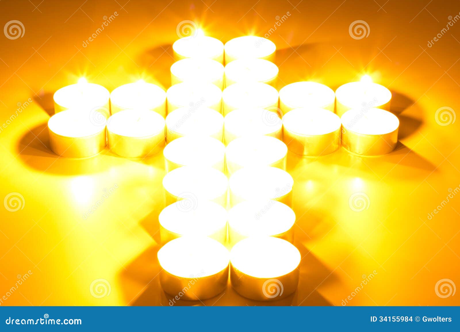 Cross of lighted candles stock photo. Image of darkness 34155984