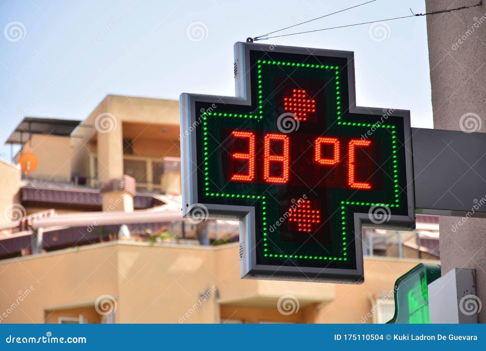 street thermometer of a pharmacy at 38 degrees celsius