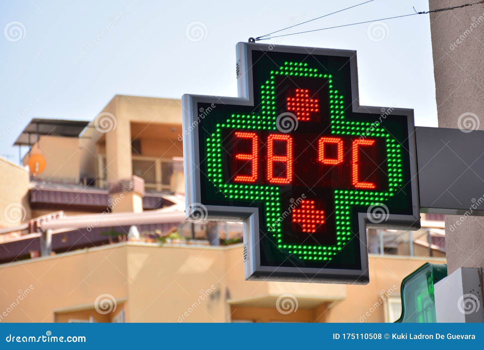 street thermometer of a pharmacy at 38 degrees celsius