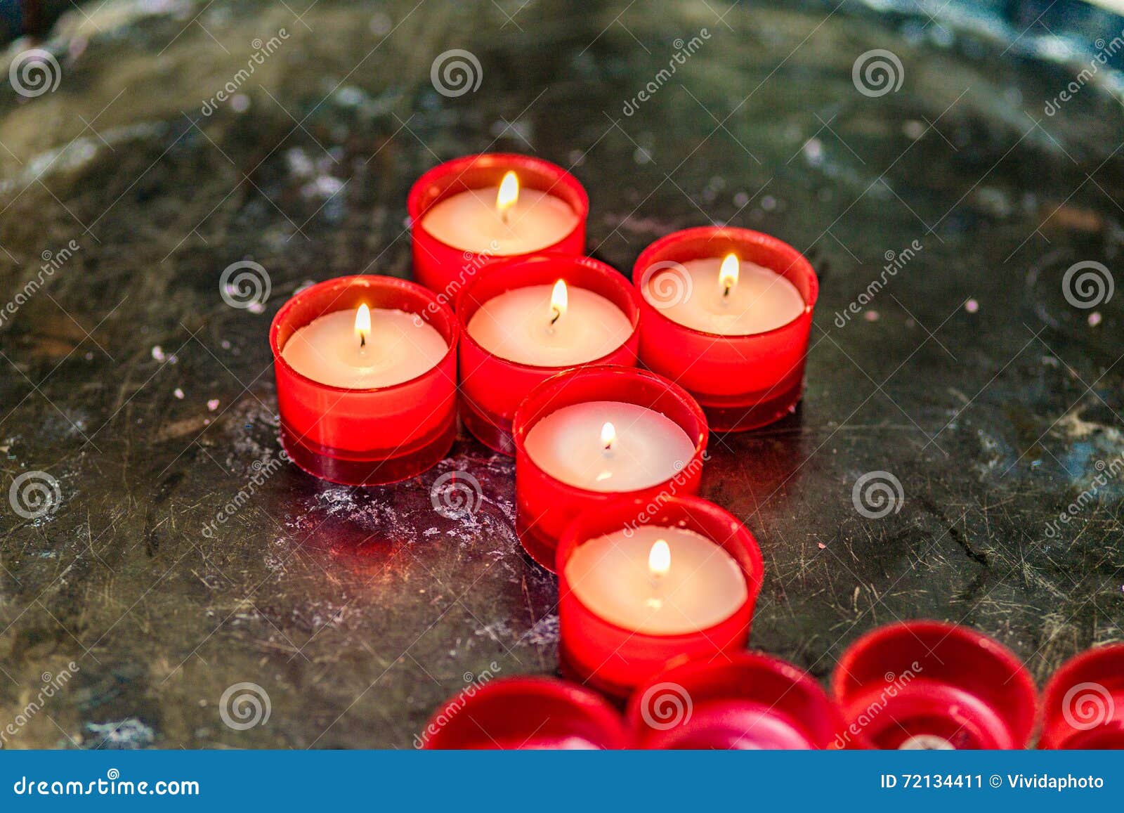 Cross of votive candles stock image. Image of flame, christian 72134411