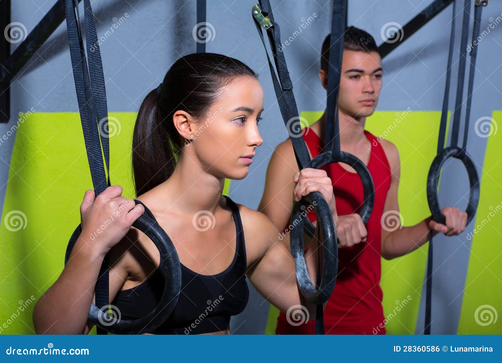 Crossfit Dip Ring Man and Woman Relaxed after Workout Stock Photo