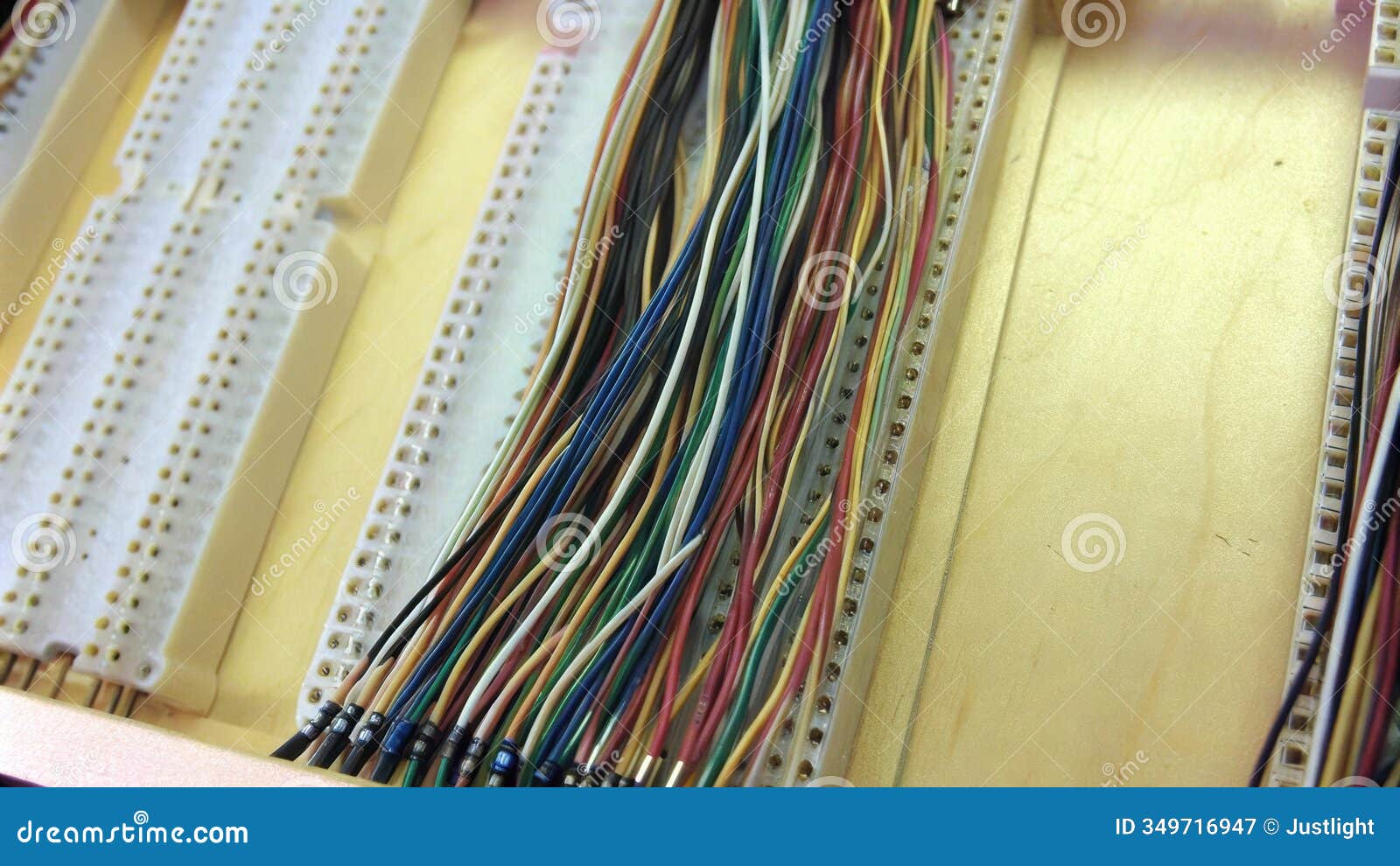 a crosssectional view of a multilayered wire harness being assembled showing the complex interplay of wires that deliver