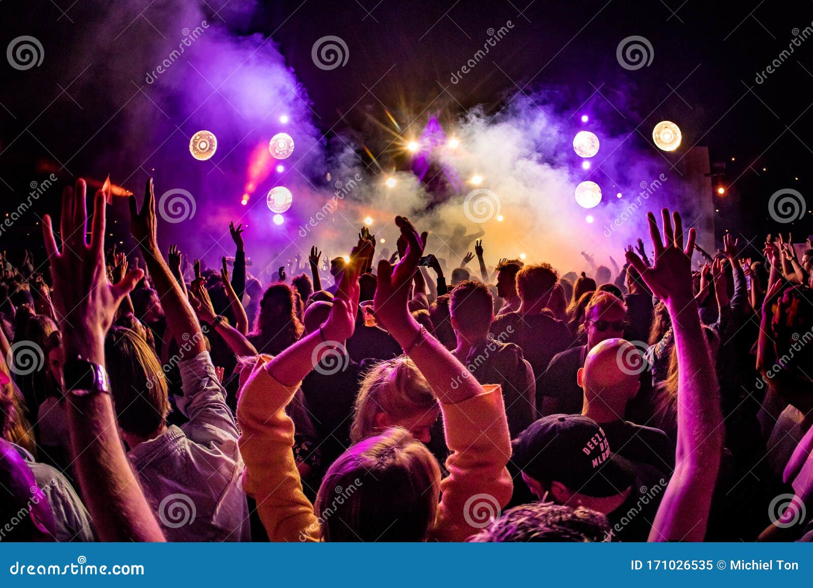 Crowd of People with Hand in the Air at an Outdoor Event Editorial ...