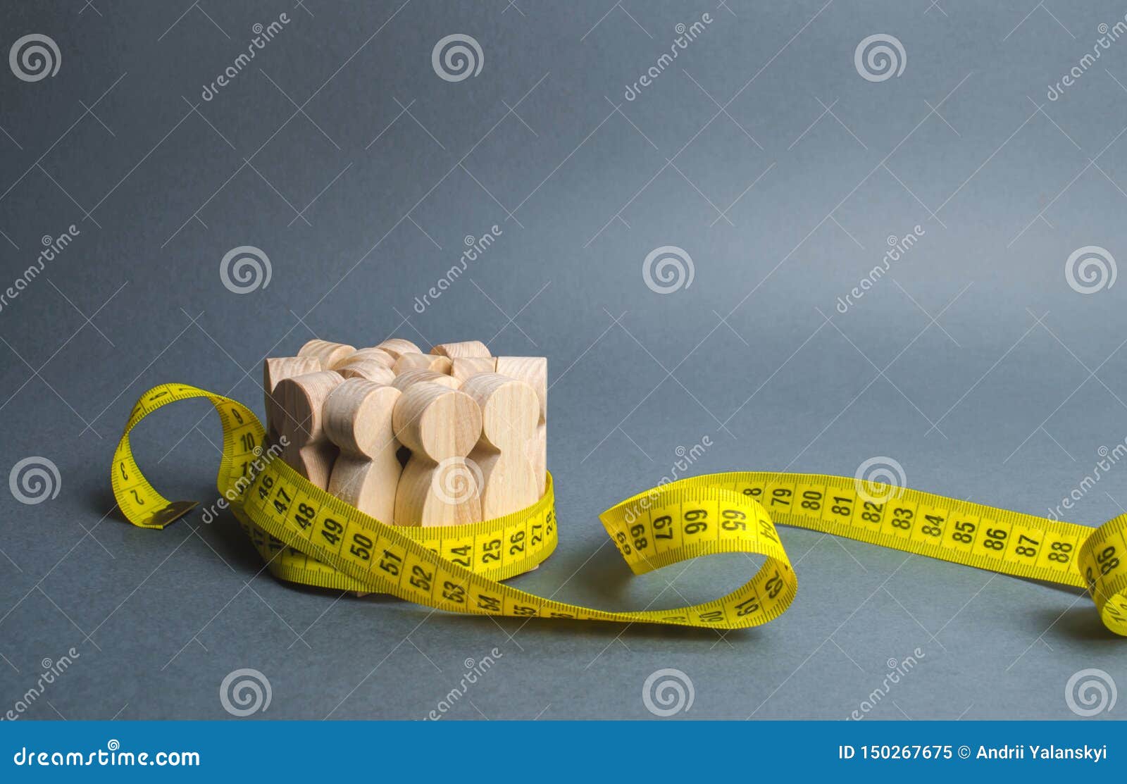 a crowd of wooden figures gripped by measuring tape. information statistics, measurement of the number, trends of population