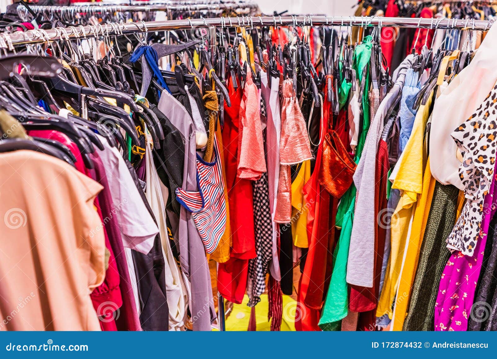 Crowded Clearance Section in a Clothing Store, with Various Colorful  Garments Placed Tightly on Racks in No Particular Order; Fast Stock Photo -  Image of apparel, garment: 172874432