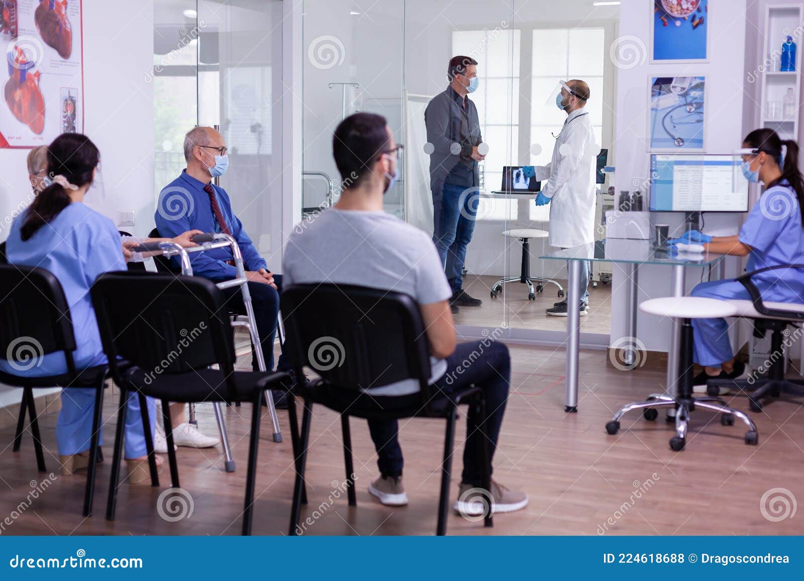 crowded new normal hospital waiting room with patients sitting on chairs