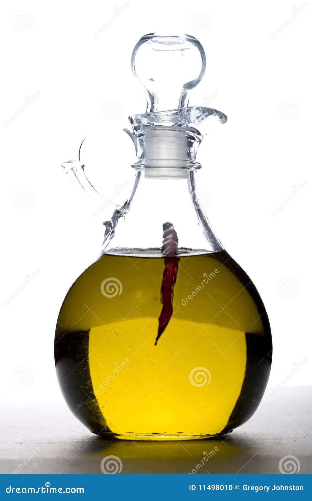 Cruet of Olive Oil with a Pepper. Stock Photo Image of mediterranean, seasoning 11498010