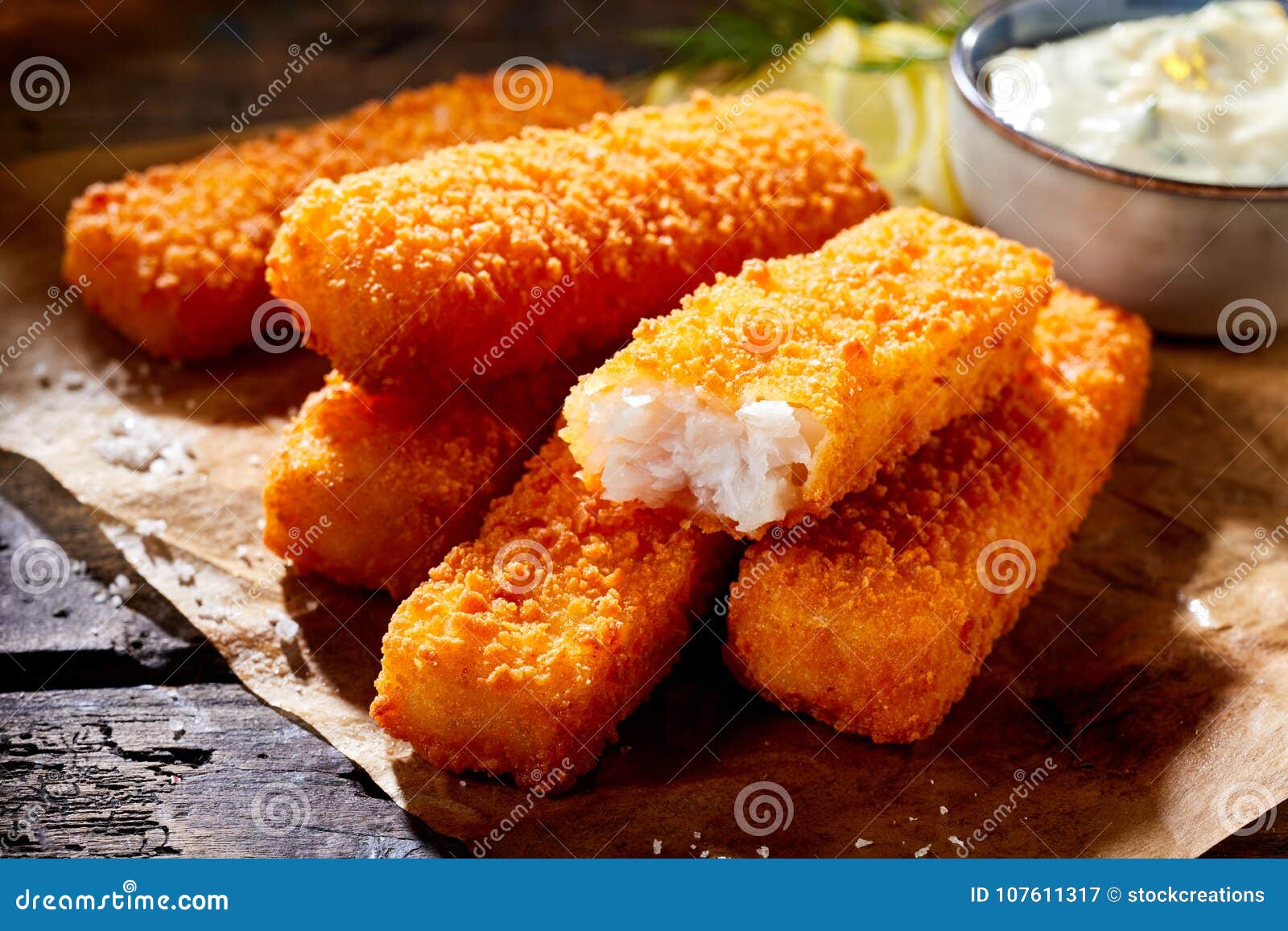 crumbed fish fingers in sticks with tartare sauce