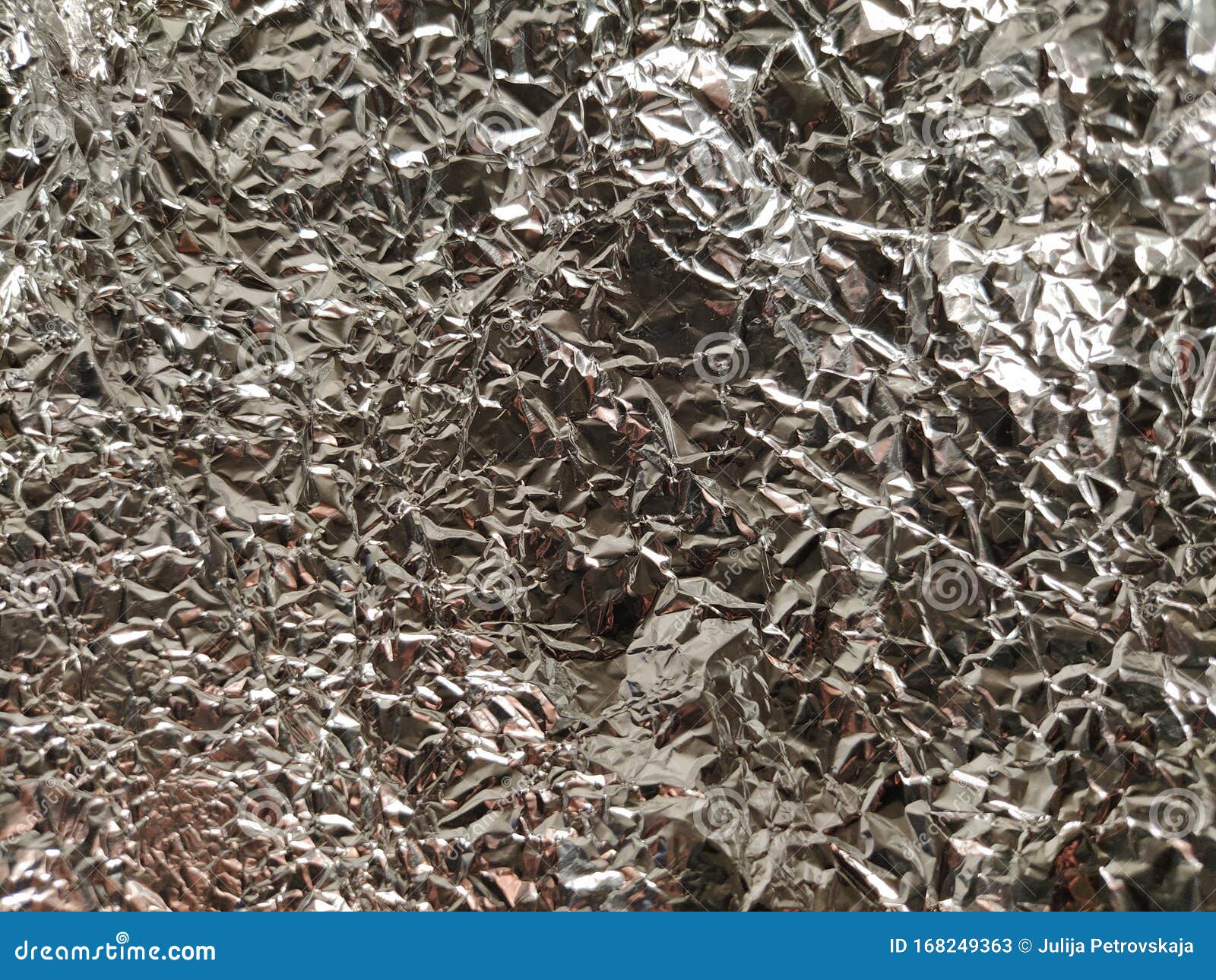 Crumpled Aluminum Foil. Reflection and Refraction of Light in Different