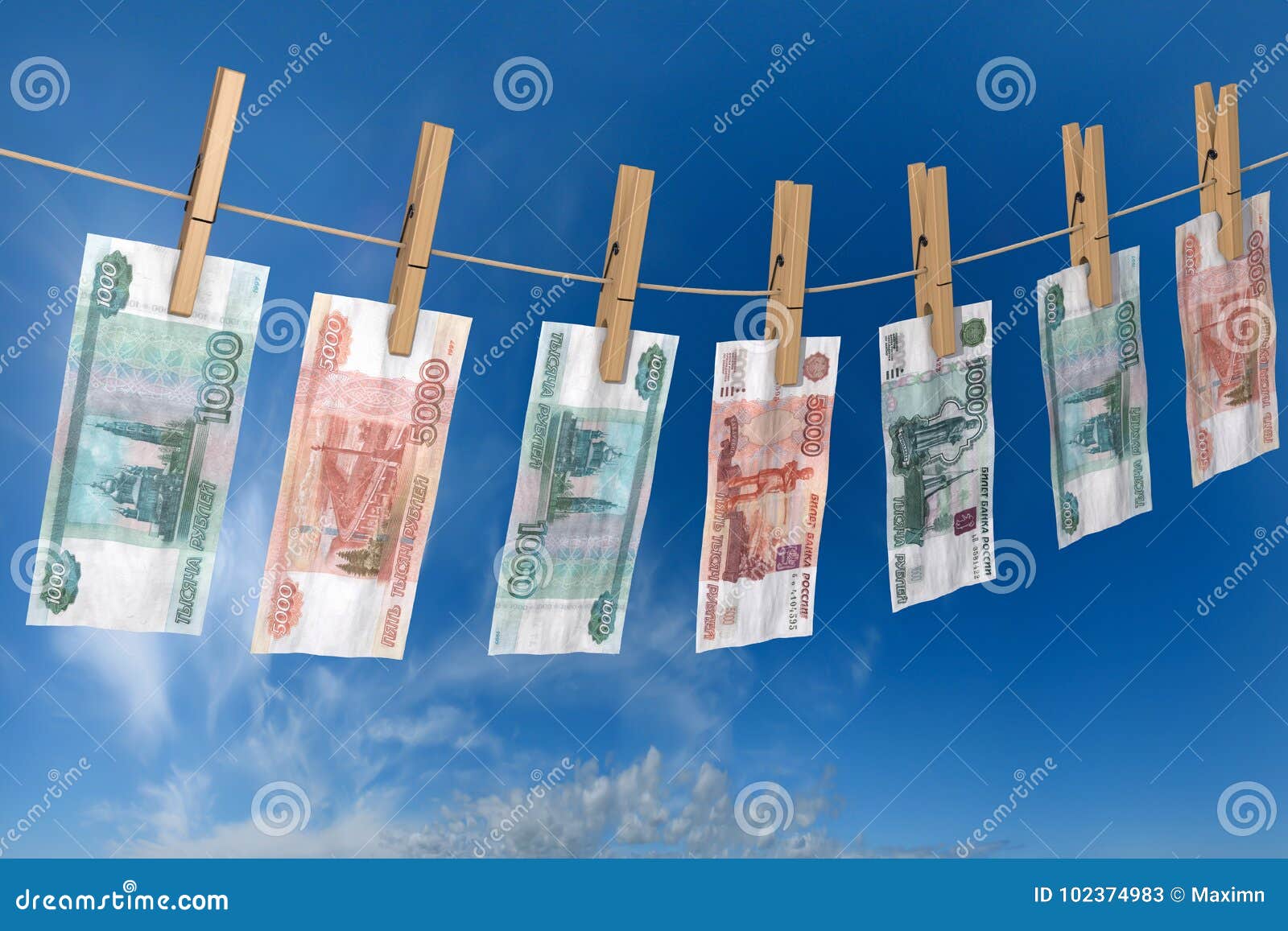 crumpled banknote of roubles to dry on the rope clothes pins attached
