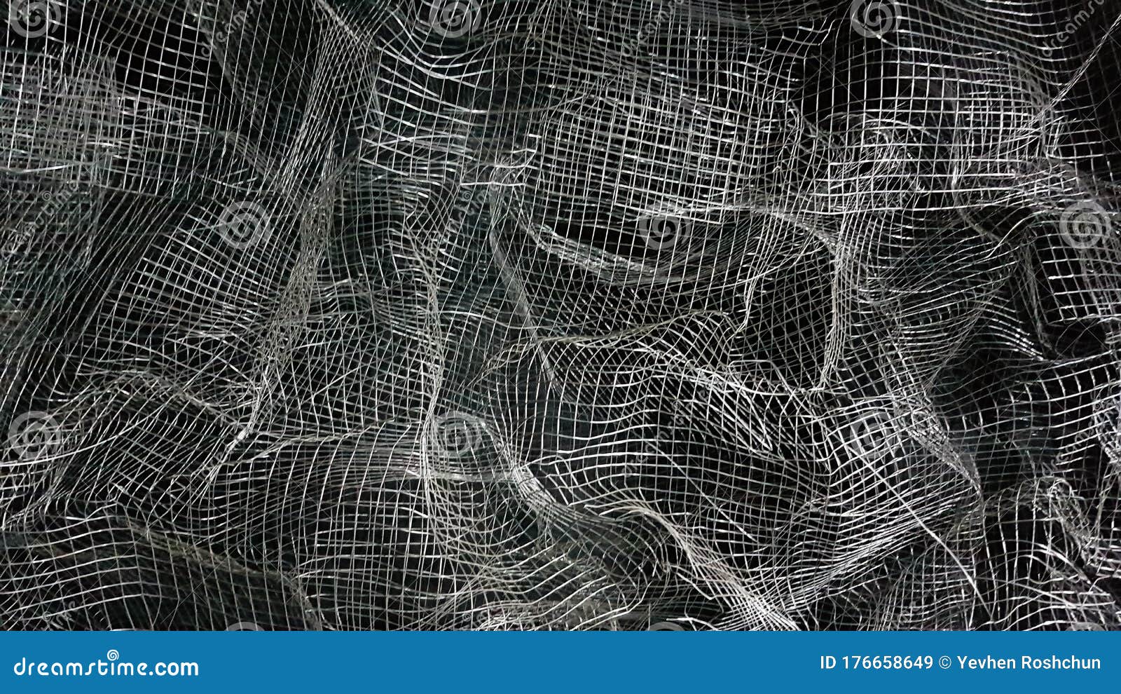 Crumpled Mesh. Abstract Background. Metal Mesh with Shadow on a Black