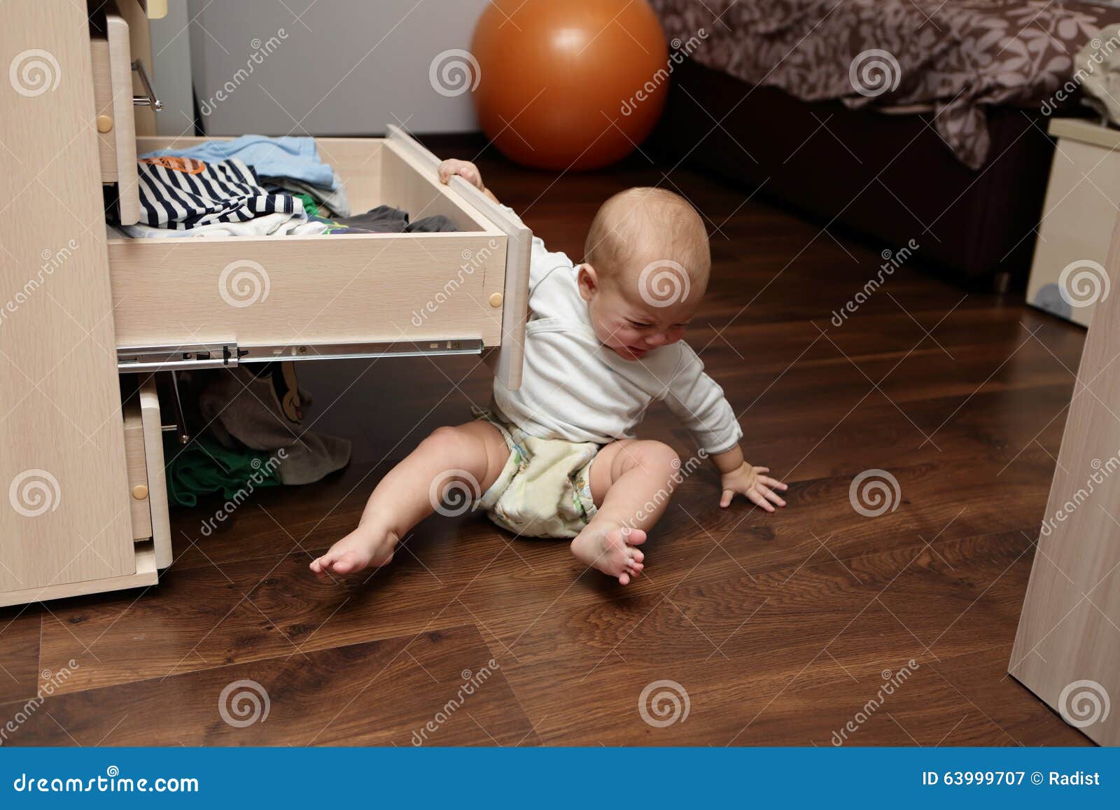 Crying baby on a floor stock image. Image of indoor, baby 63999707