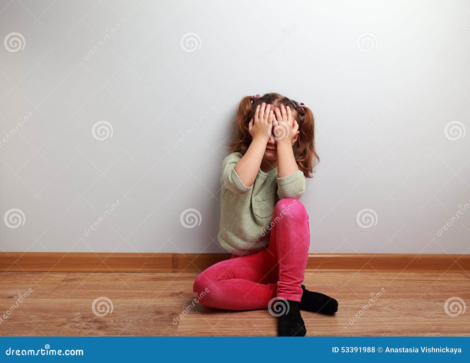 Crying Unhappy Kid Girl Sitting On The Floor With Closed Face Stock Photo Image 53391988