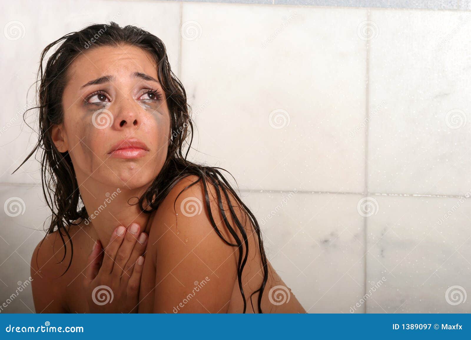 Nude woman crying
