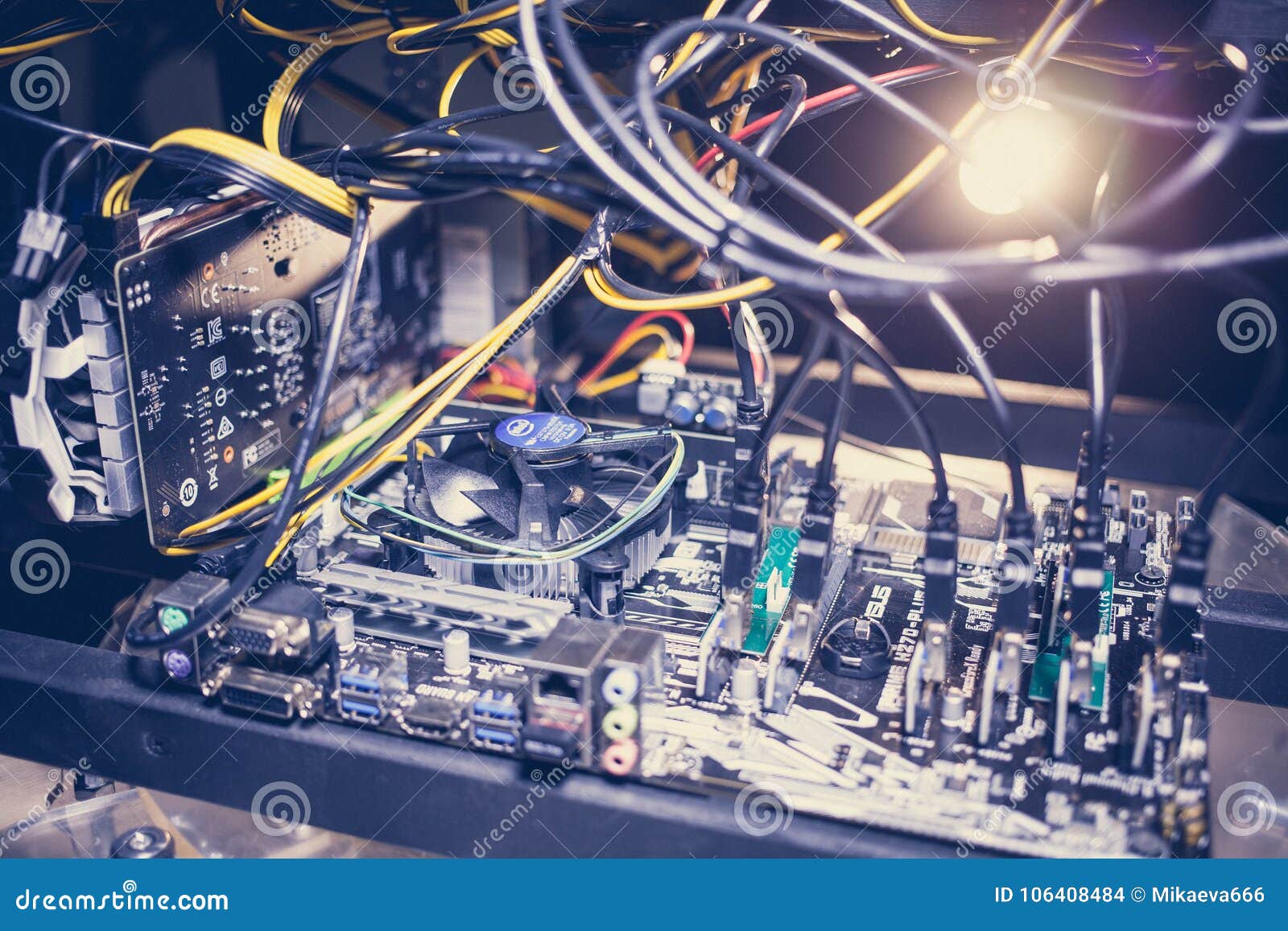 cryptocurrency mining rig pcie riser extenders plugged to motherboard.